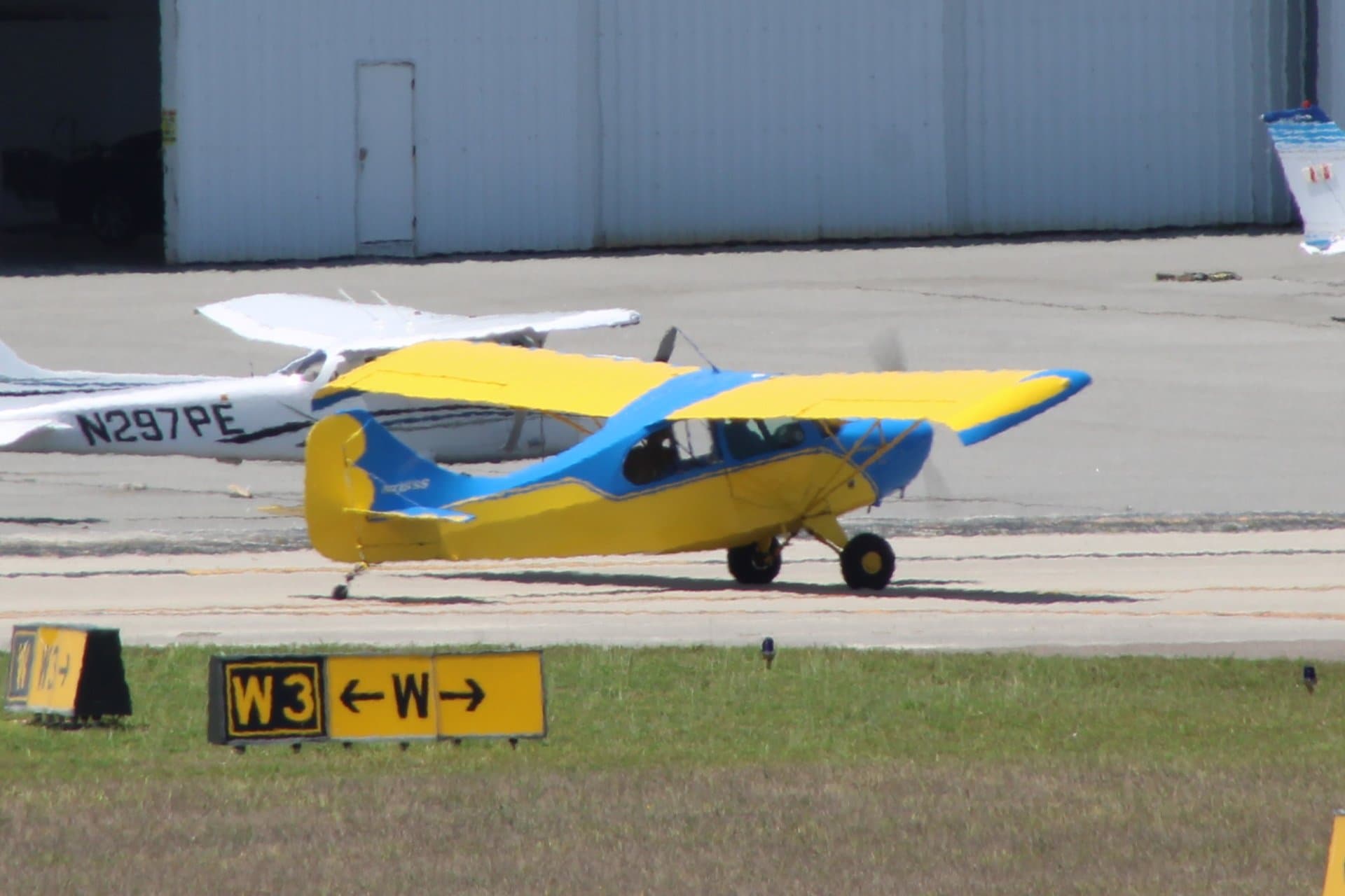 An Aeronca 7EC Traveler, registration N715SS, parked at an airfield