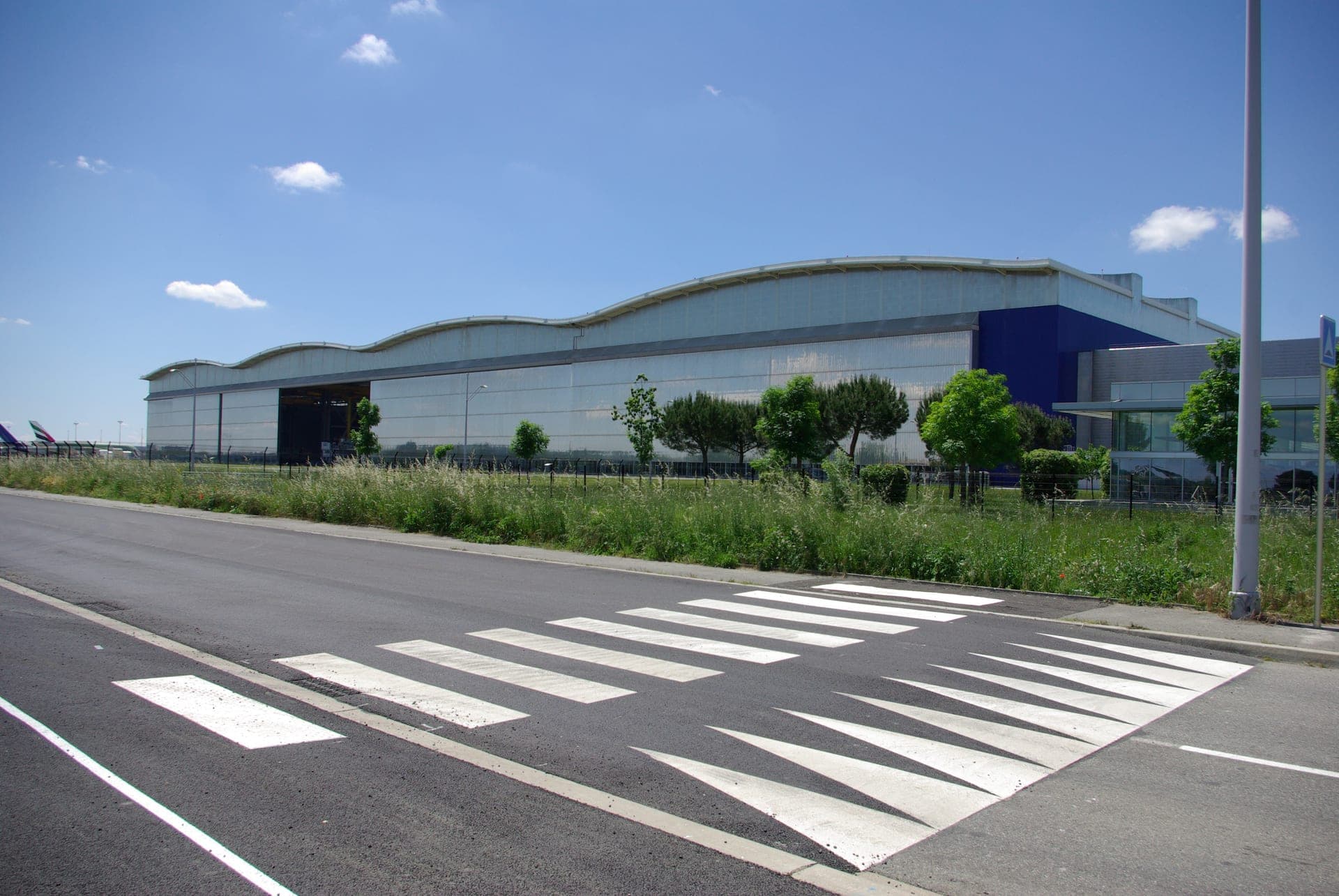 The Jean-Luc Lagardère final assembly hall in Toulouse, an A380 fuselage under construction inside the purpose-built facility