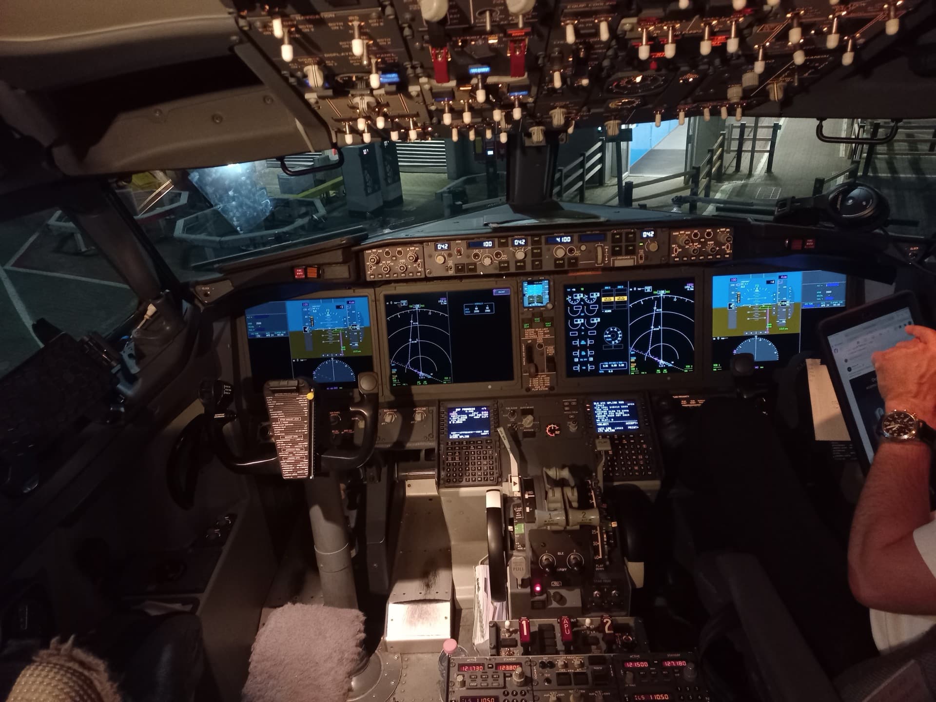 The flight deck of a Boeing 737 MAX, with large-format primary flight and navigation displays replacing the round dial instruments of earlier generations