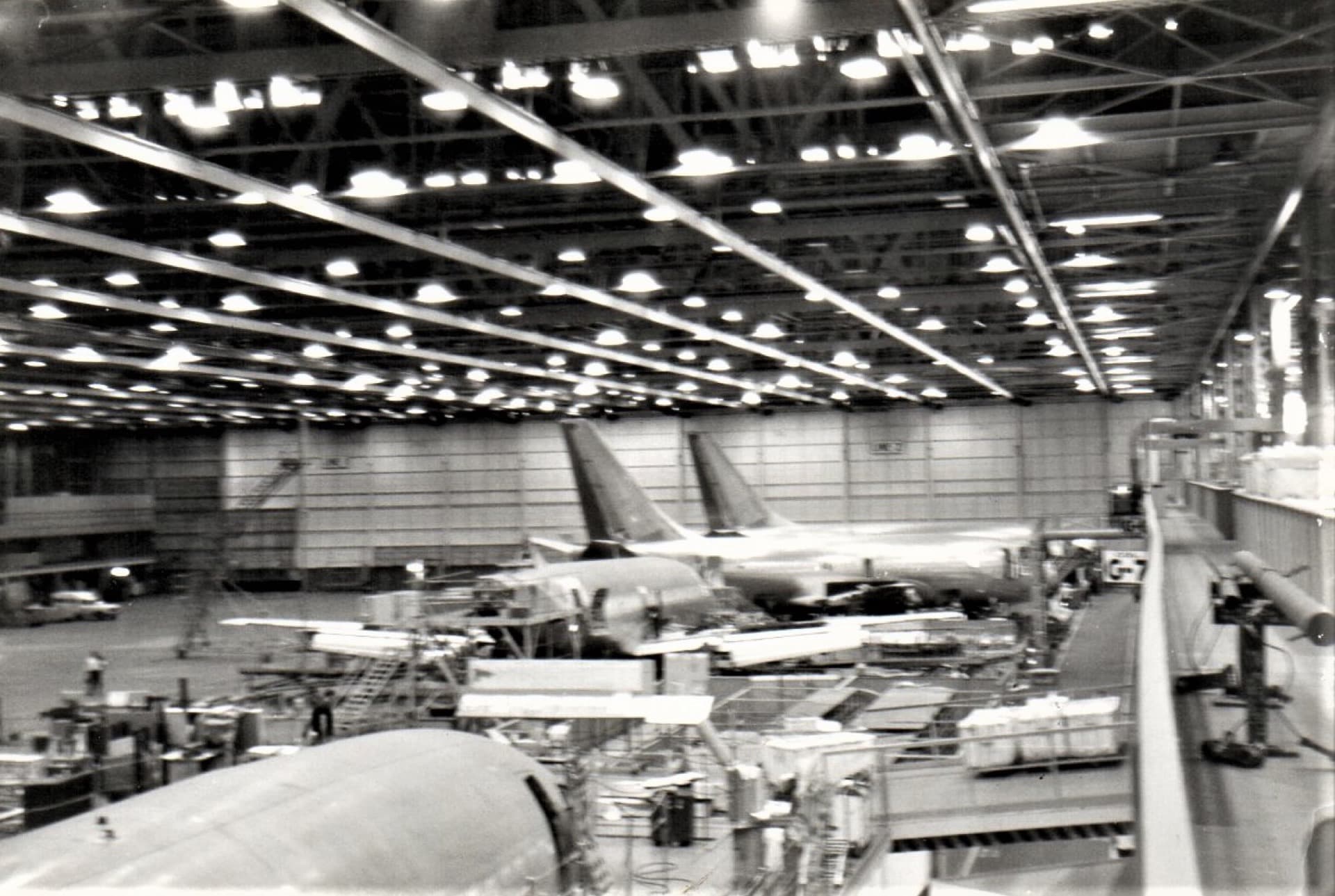 The Boeing 737 final-assembly line at the Renton factory in 1972, with fuselages moving down the line under construction