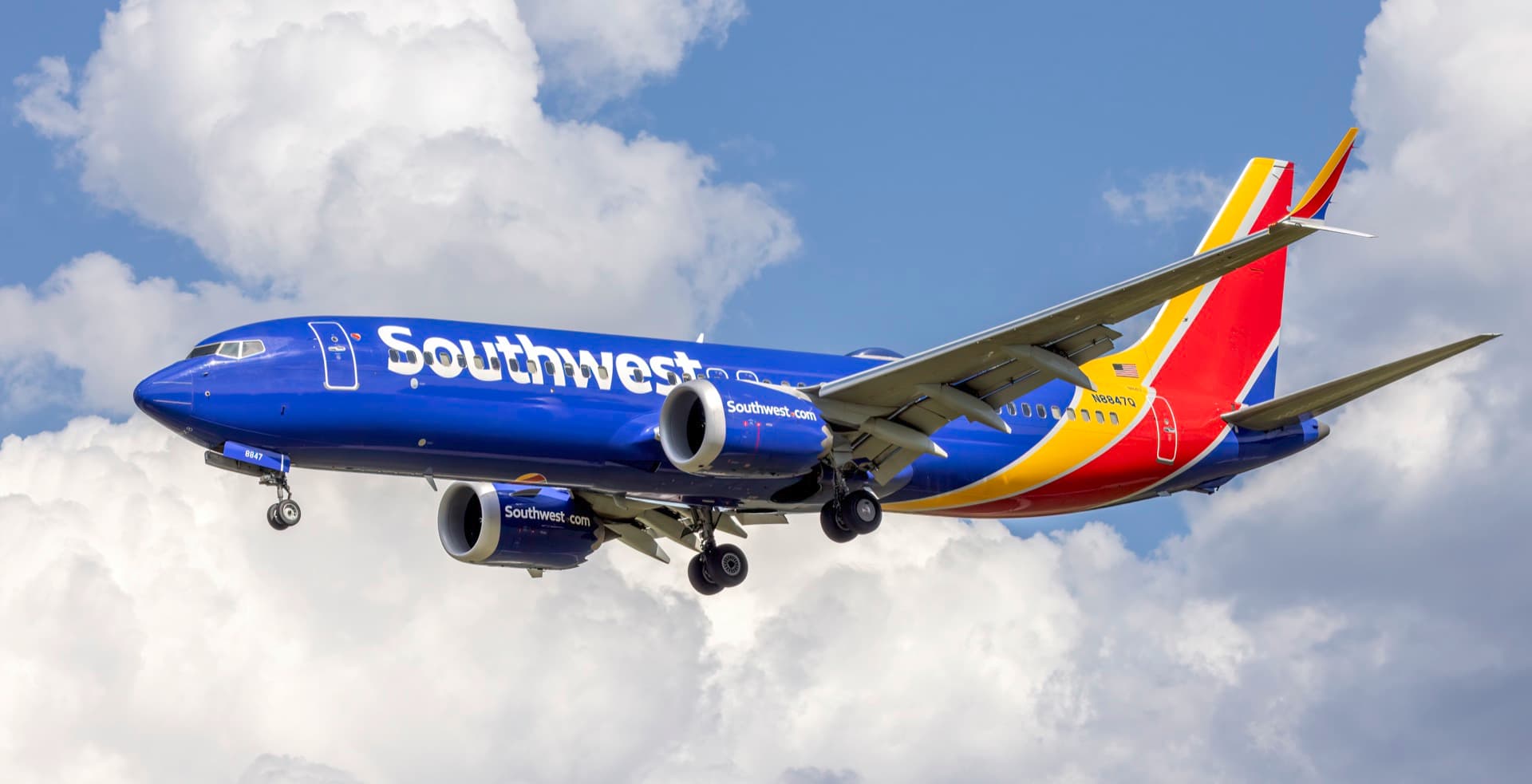 A Southwest Airlines Boeing 737 MAX 8 on the ramp, its split-tip winglets and slimmer tail cone distinguishing it from the Next Generation