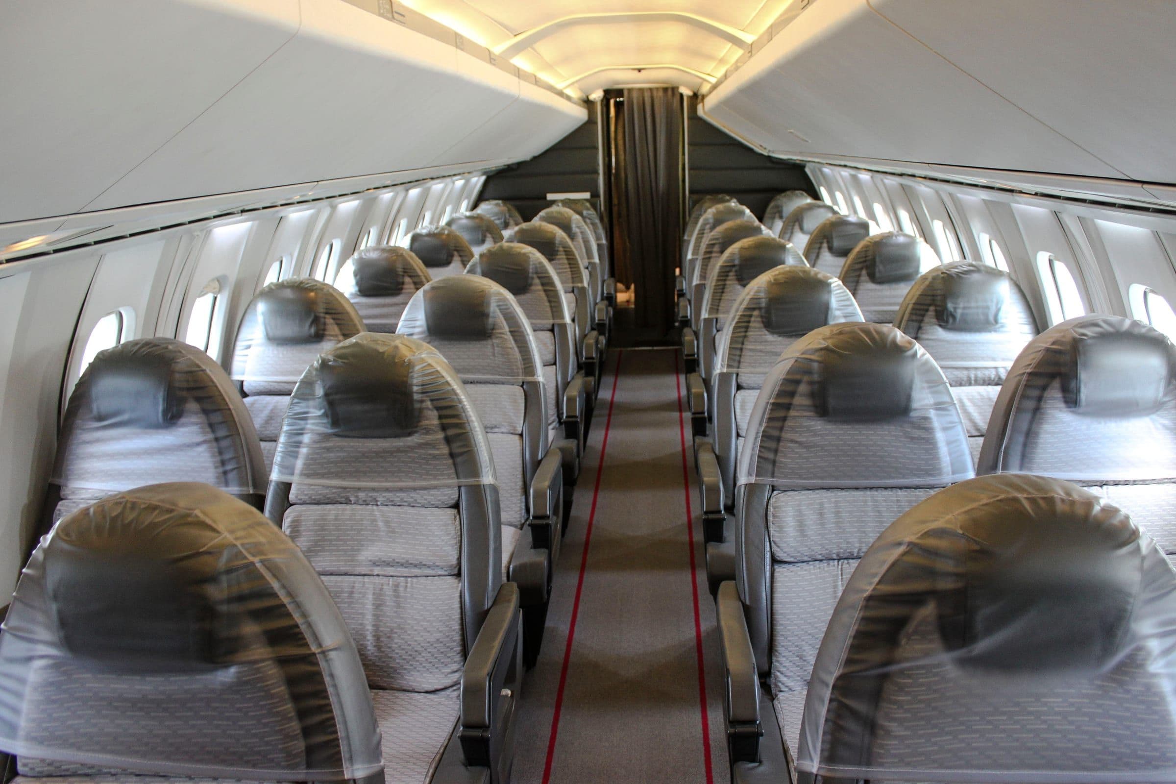 Concorde's narrow cabin, four seats abreast across a fuselage only 2.63 metres wide internally, aboard G-BBDG at Brooklands Museum