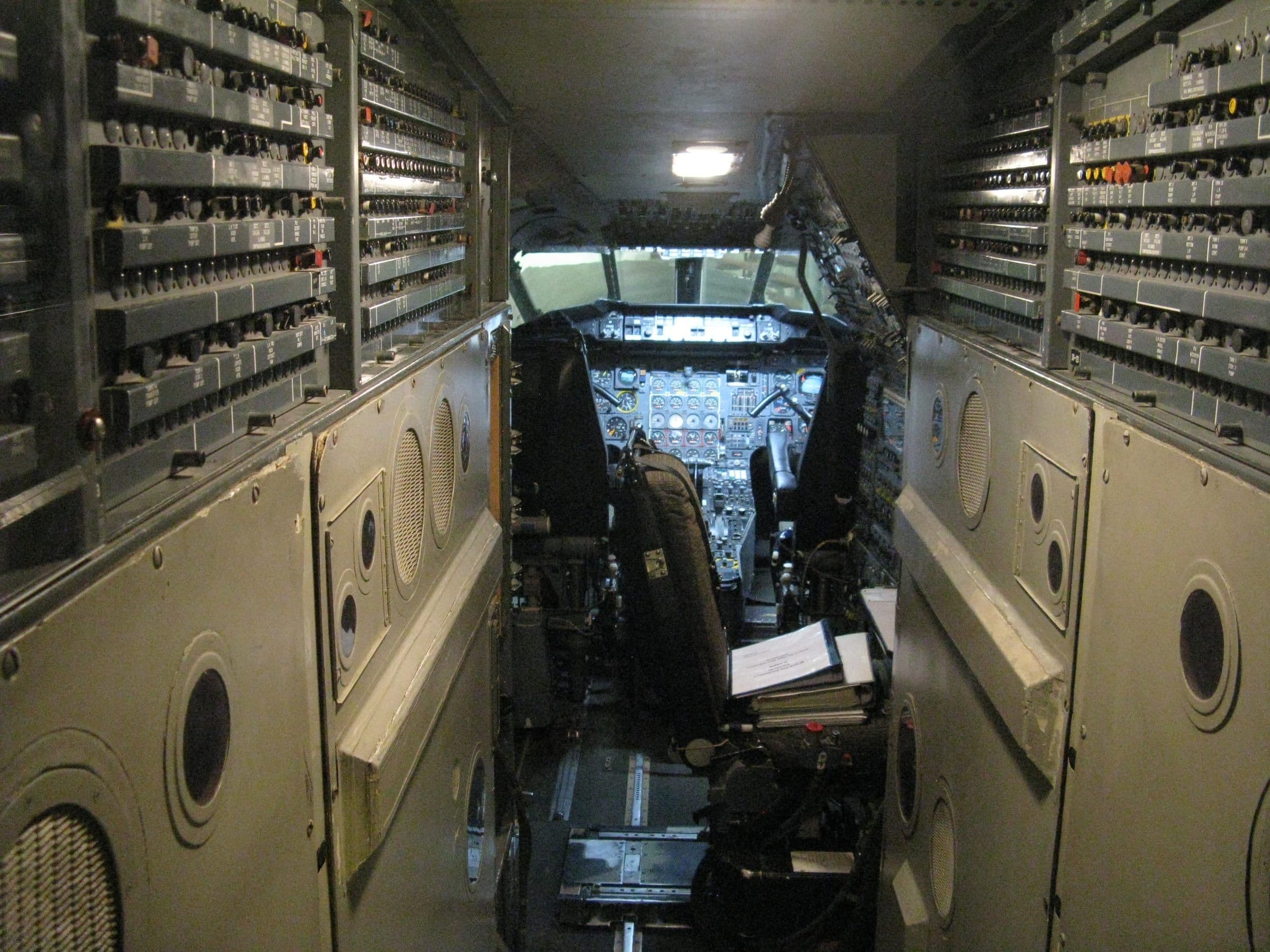 The flight deck of Concorde G-AXDN, seen from behind, with the flight engineer's analogue system panels lining both walls
