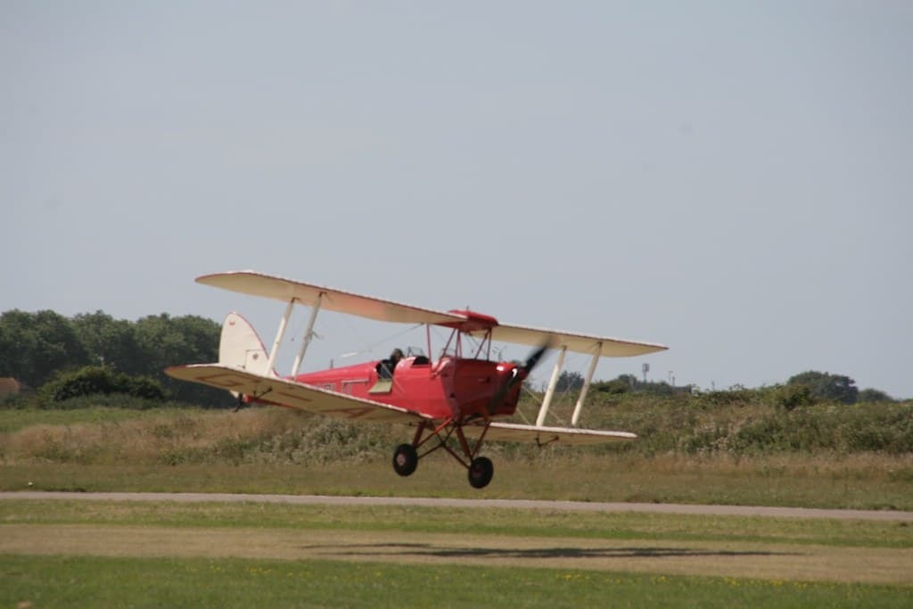 A Tiger Moth on final approach to land