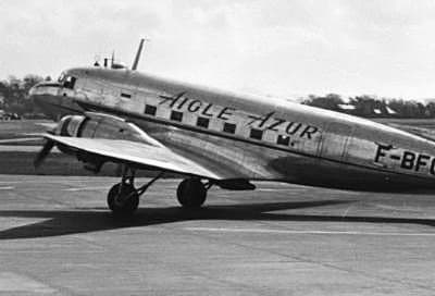 A Douglas DC-3 in the livery of French airline Aigle Azur, registration F-BFGx, parked on the ramp