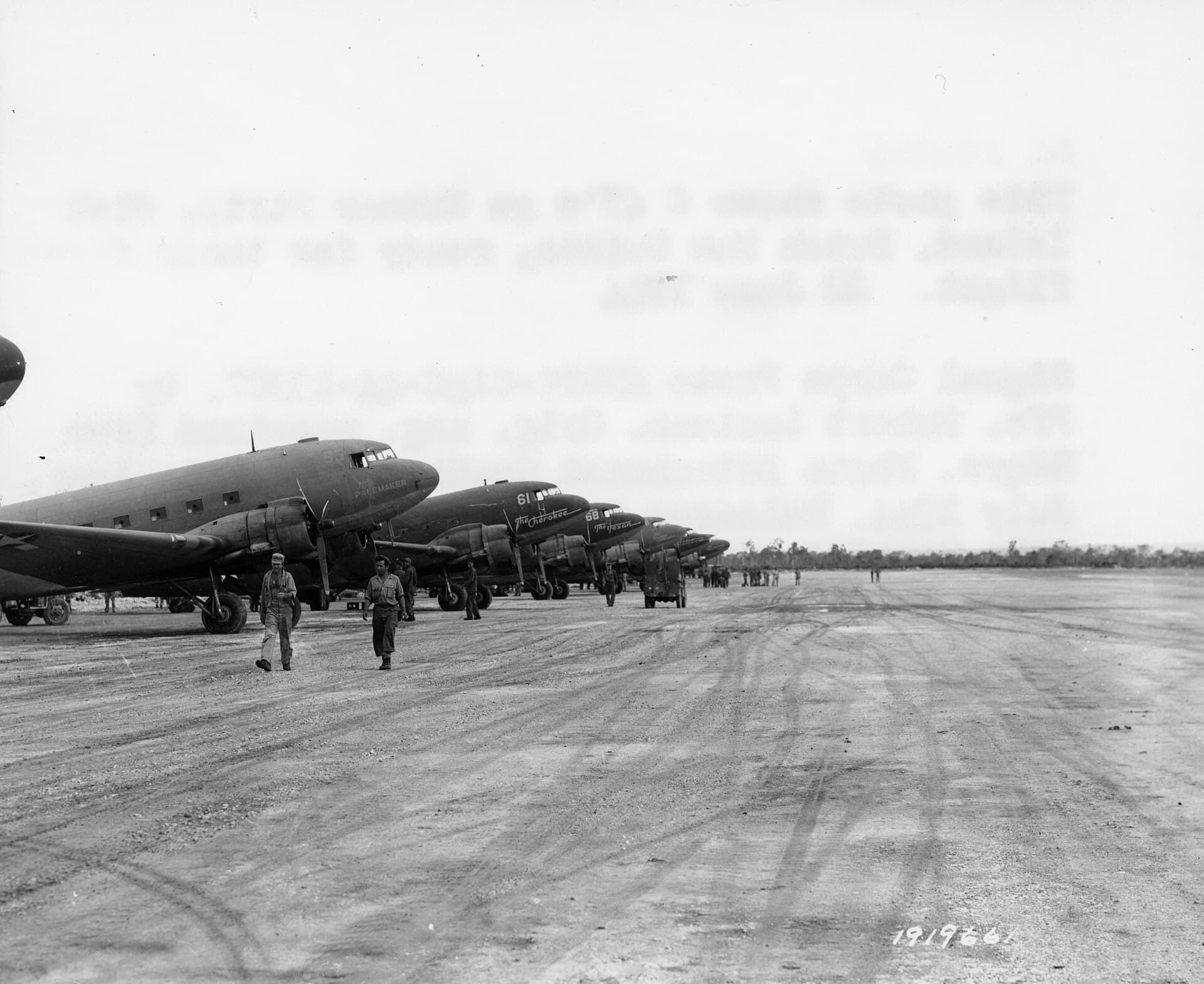 Douglas C-47s lined up on Mokmer Strip, Biak Island, Dutch New Guinea, ready for their first flight, 22 June 1944