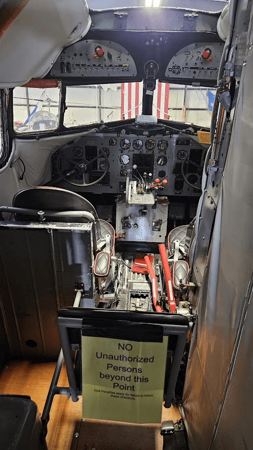 The cockpit interior of the preserved DC-3 'Miss Montana', showing its instrument panel and overhead switches
