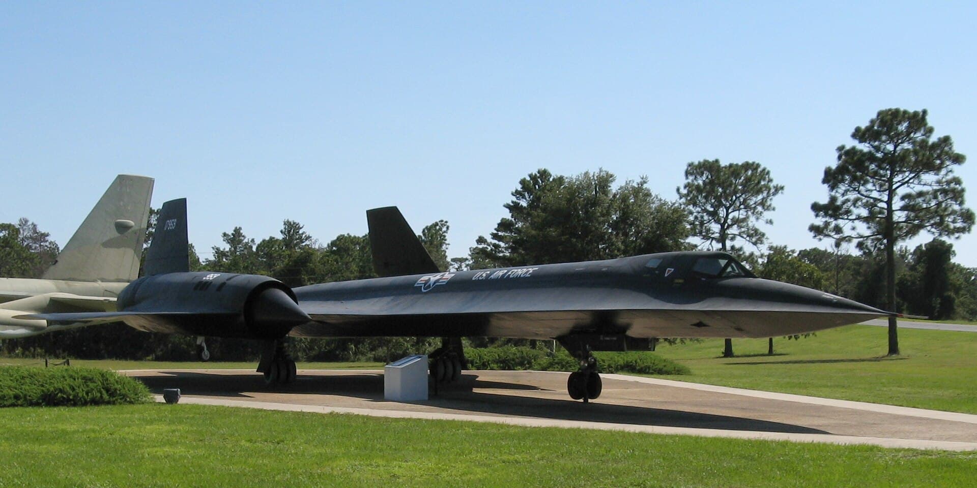 A retired SR-71 on outdoor static display on the grass at the USAF Armaments Museum, Eglin Air Force Base, Florida