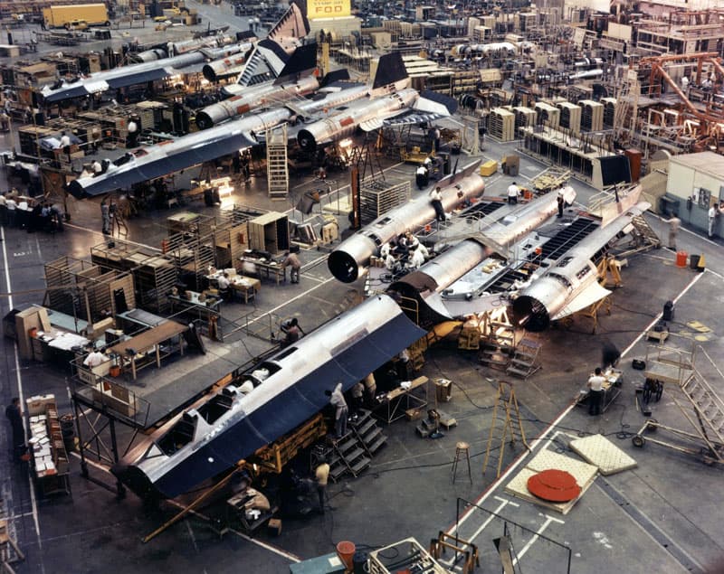 Overhead view of the Skunk Works factory floor with several Blackbird-family airframes under construction side by side
