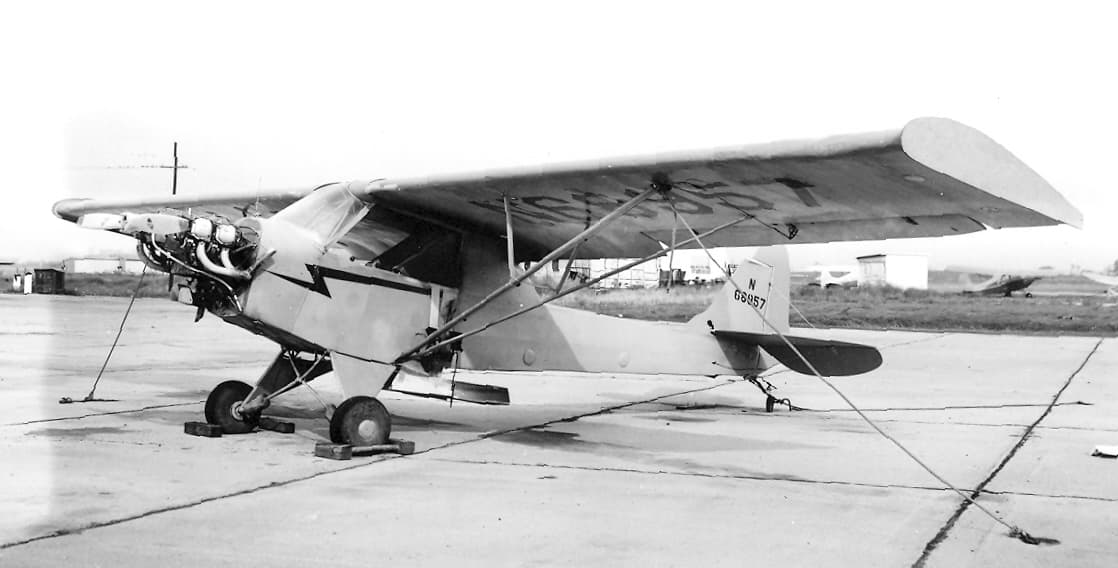 A Piper J-3 Cub converted for agricultural crop-dusting work, with a spray tank fitted