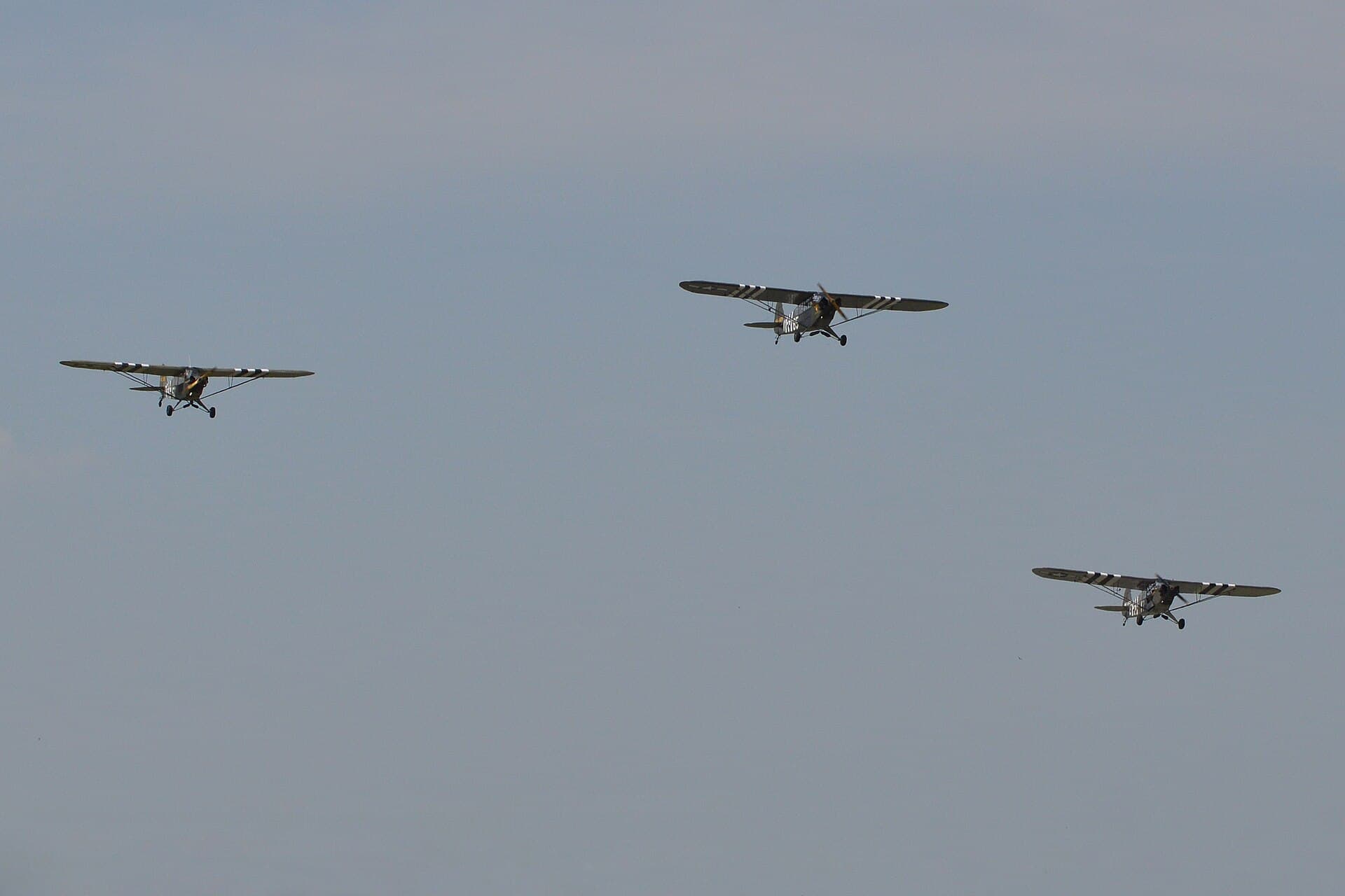Three Piper Cubs flying in formation