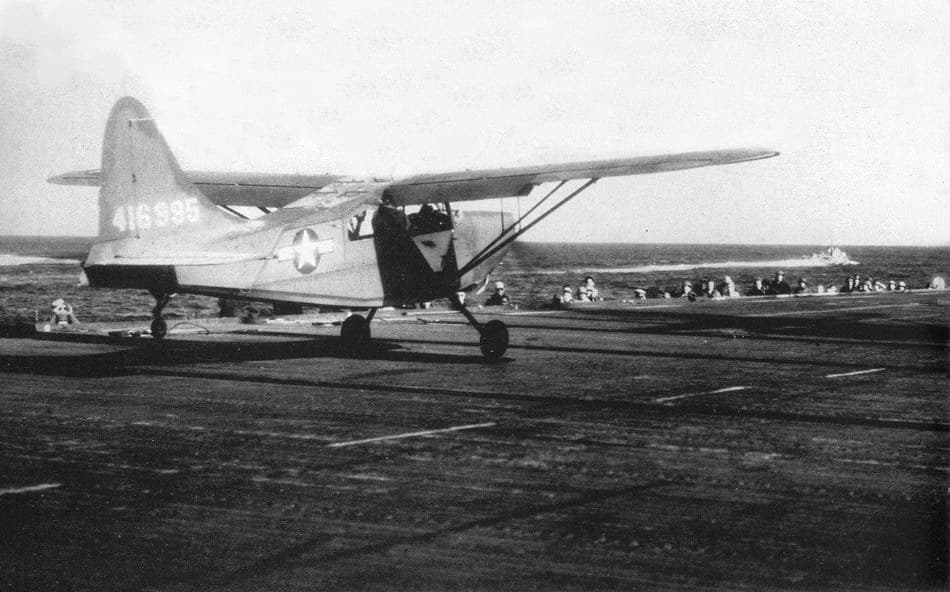 A Stinson L-5B Sentinel takes off from the escort carrier USS Marcus Island, around 1944