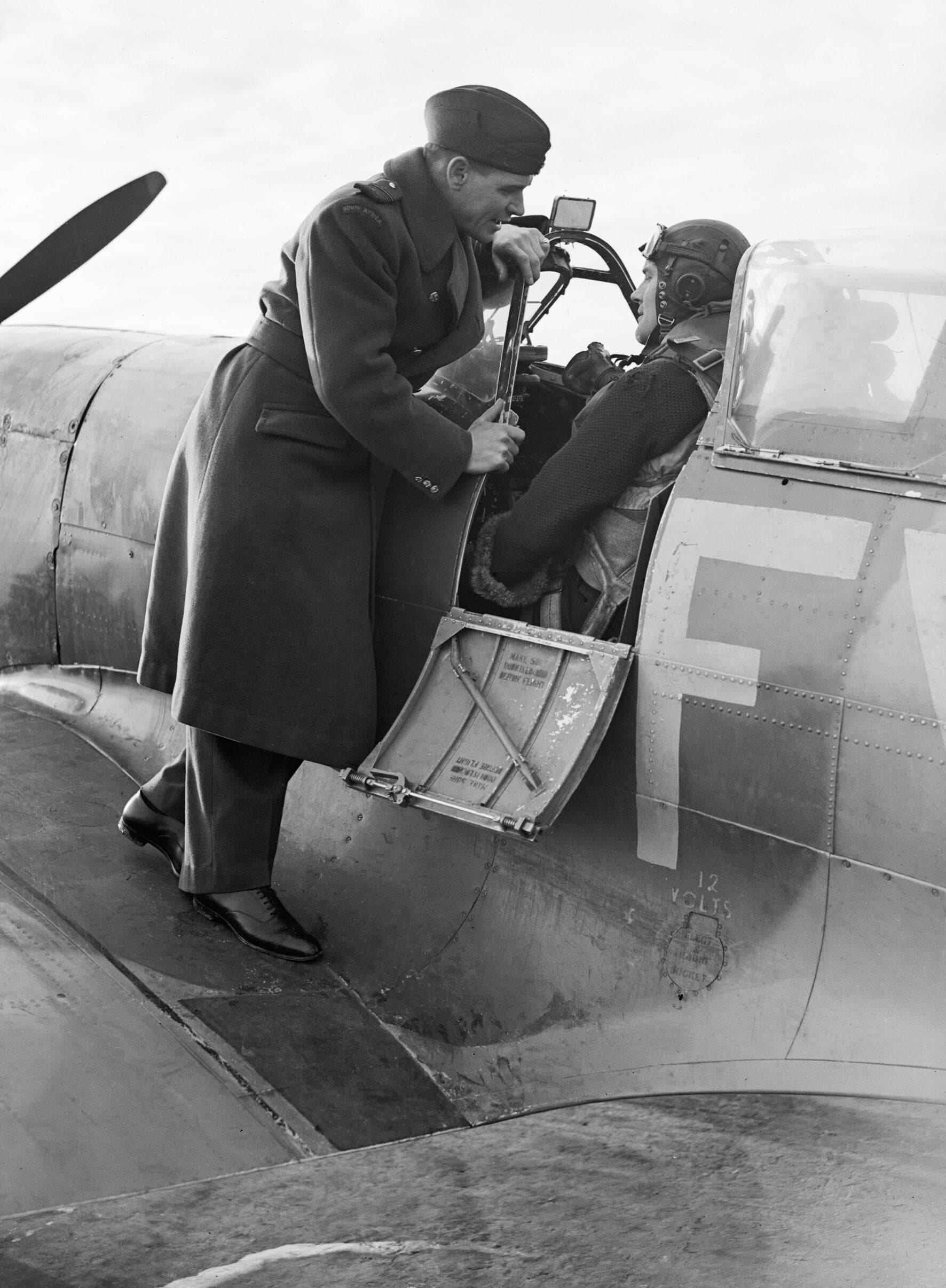 Group Captain A. G. 'Sailor' Malan on the wing of a Spitfire Mk IX at Biggin Hill, 2 January 1943