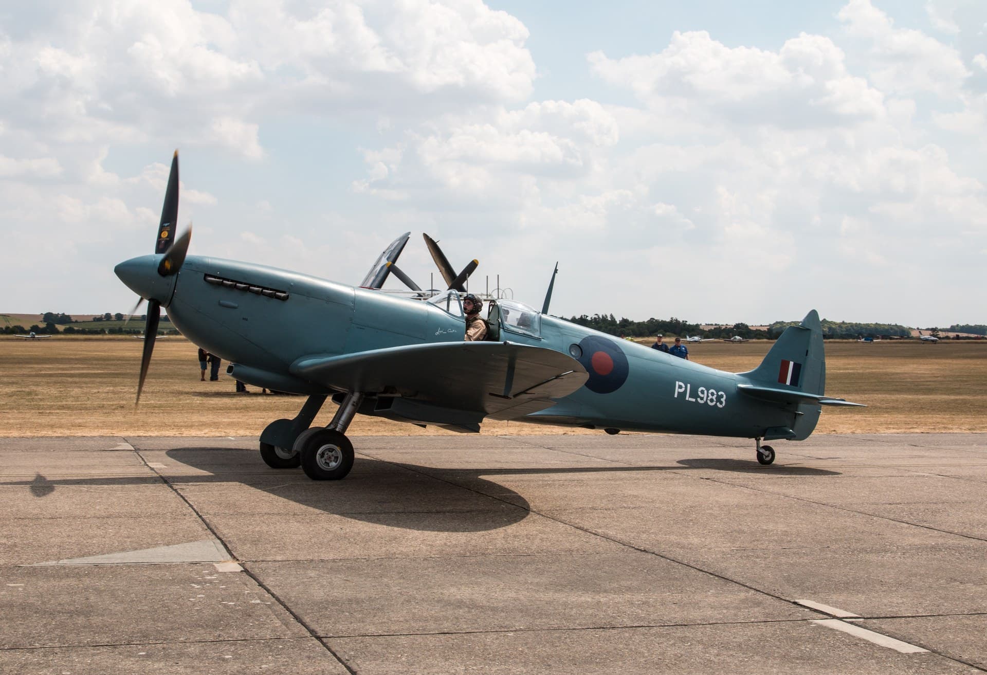 A Merlin-engined Supermarine Spitfire PR Mk IX, PL983, taxiing at Flying Legends, showing its elliptical wing in profile