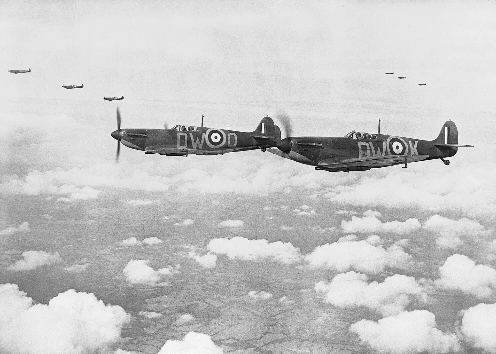 Spitfire Mk Is of No. 610 Squadron flying in vic formation from Biggin Hill during the Battle of Britain, 24 July 1940