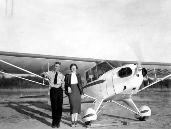 Student pilot Betty Wynn with instructor Ivan Munroe beside a Taylorcraft trainer, Tallahassee, Florida, 1940s