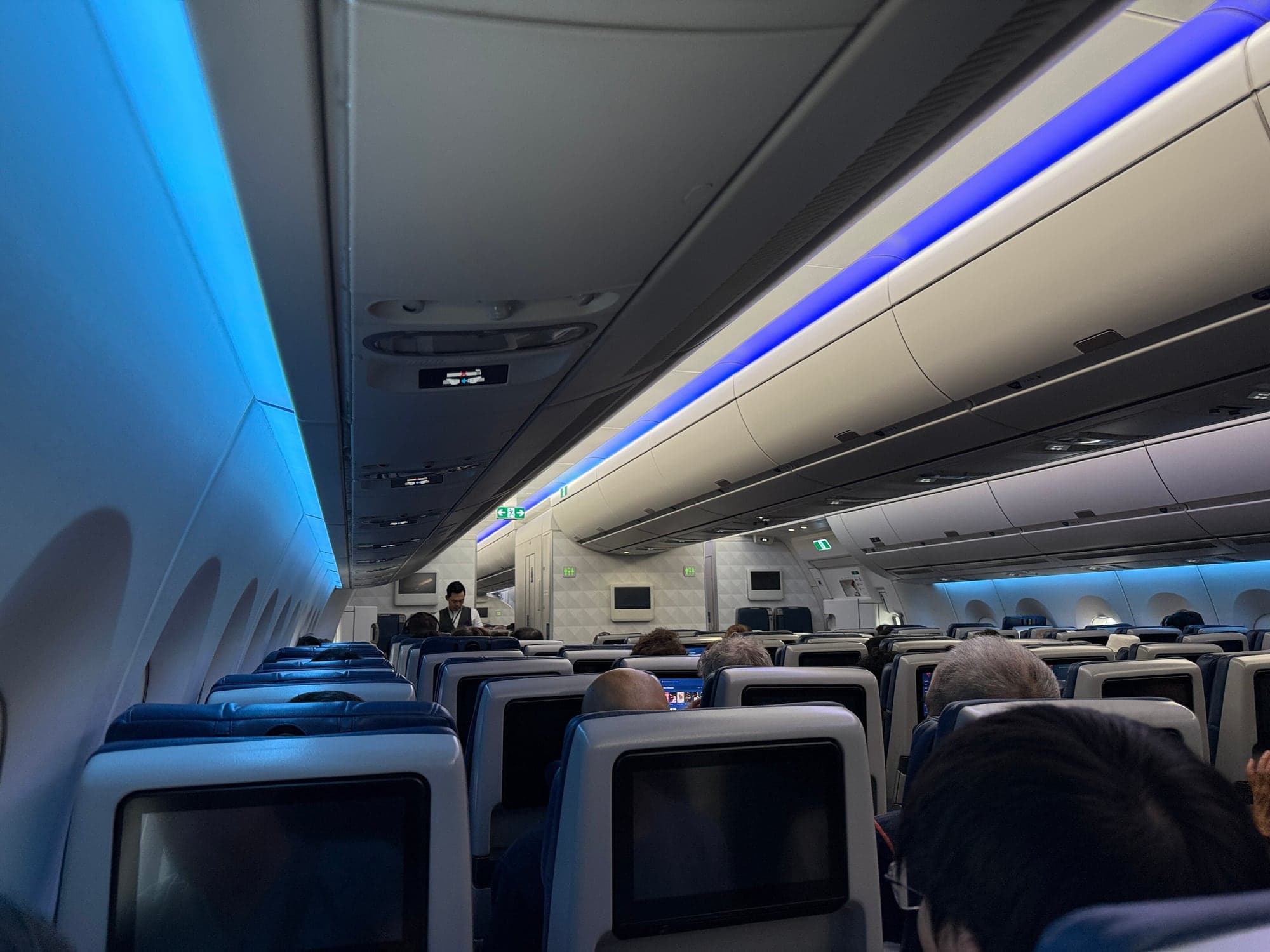 The Main Cabin of a Delta Airbus A350-900 in May 2026, seen from the aisle.