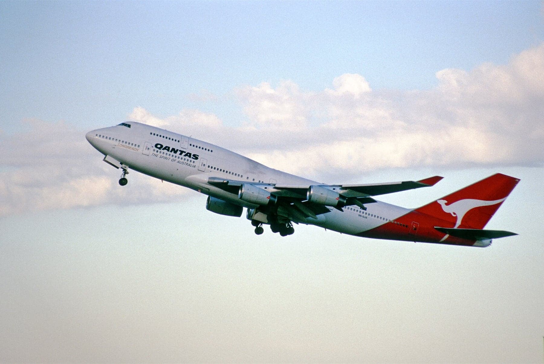 The Boeing 747-438 VH-OJA City of Canberra at Sydney in September 1999. On its delivery flight in August 1989 it flew London to Sydney non-stop, 18,001 km in 20 hours and 9 minutes.