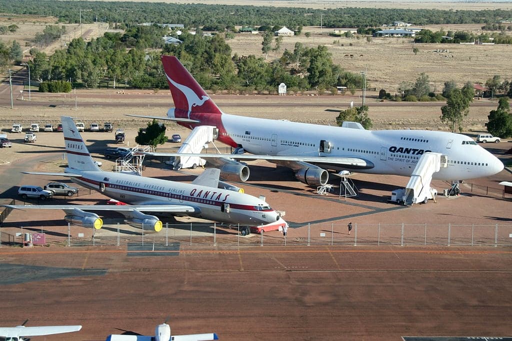 The first Qantas Boeing 707, VH-XBA, and a Boeing 747-200 preserved at the Qantas Founders Museum at Longreach, on the airfield where the airline built its own aircraft in the 1920s.
