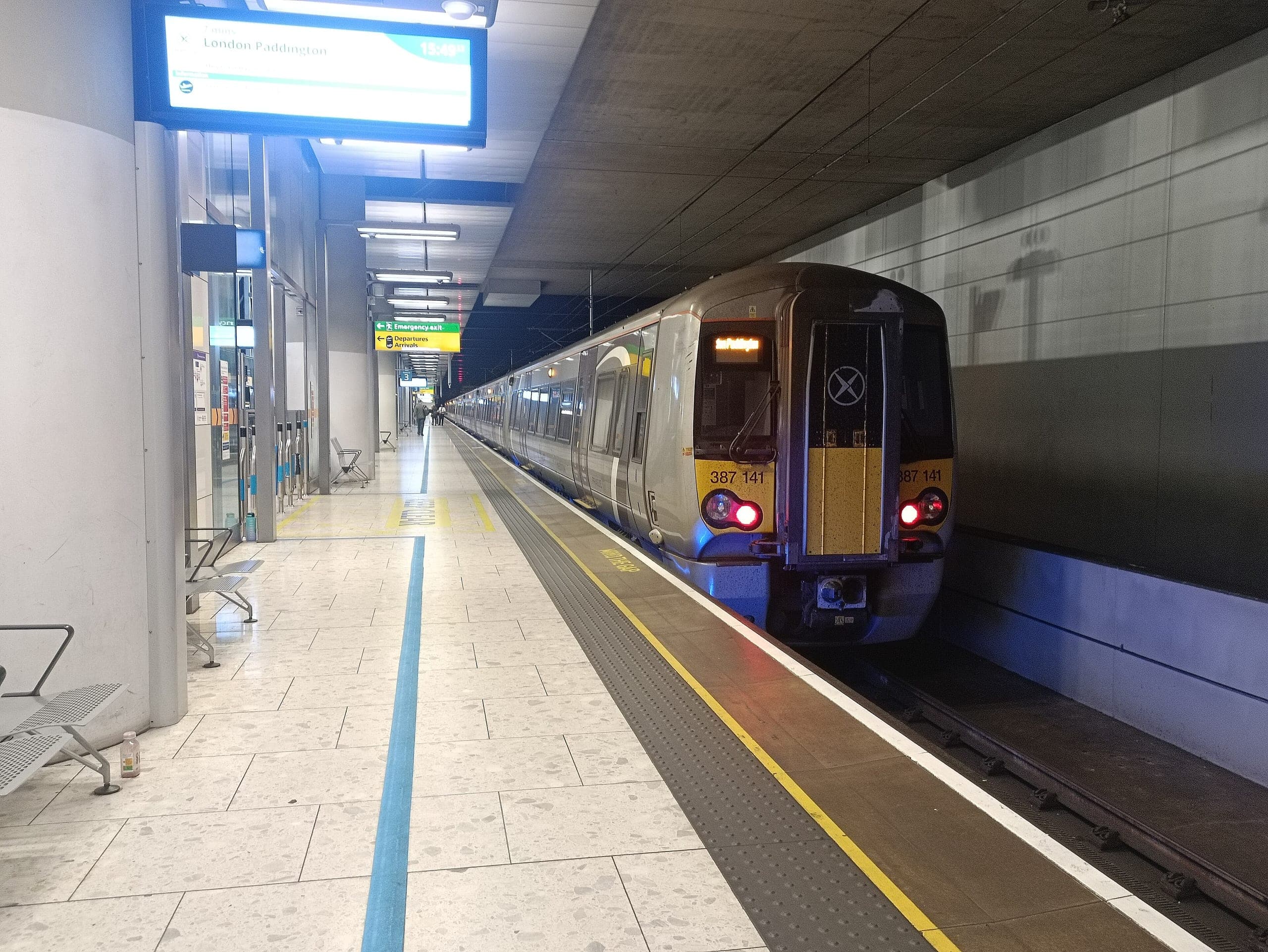 A Heathrow Express train at the Terminal 5 platform, the next departure for London Paddington shown on the indicator