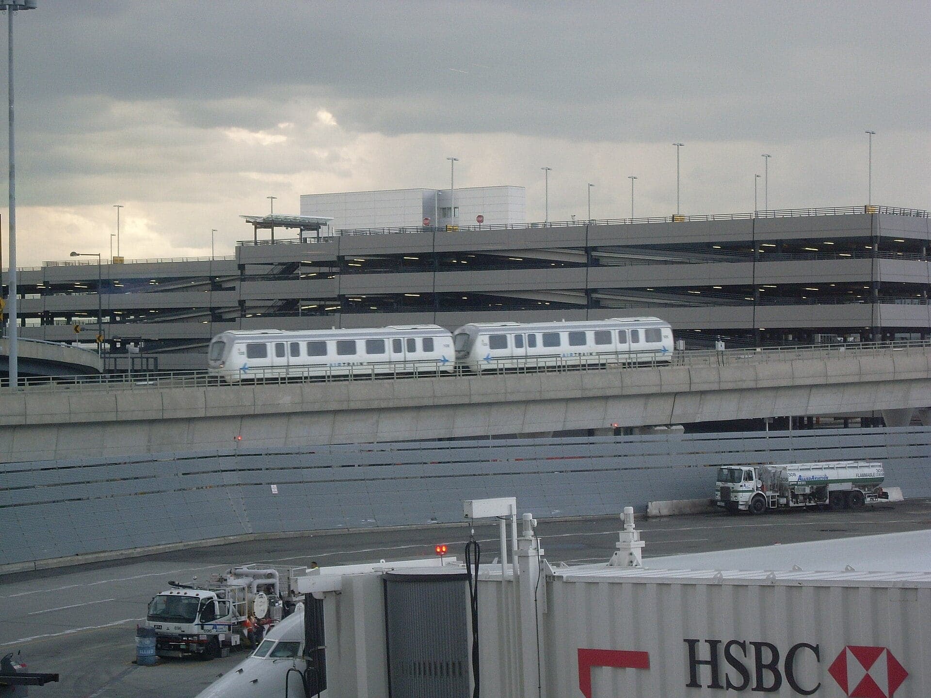 An AirTrain JFK train on its elevated guideway outside Terminal 4 in 2008