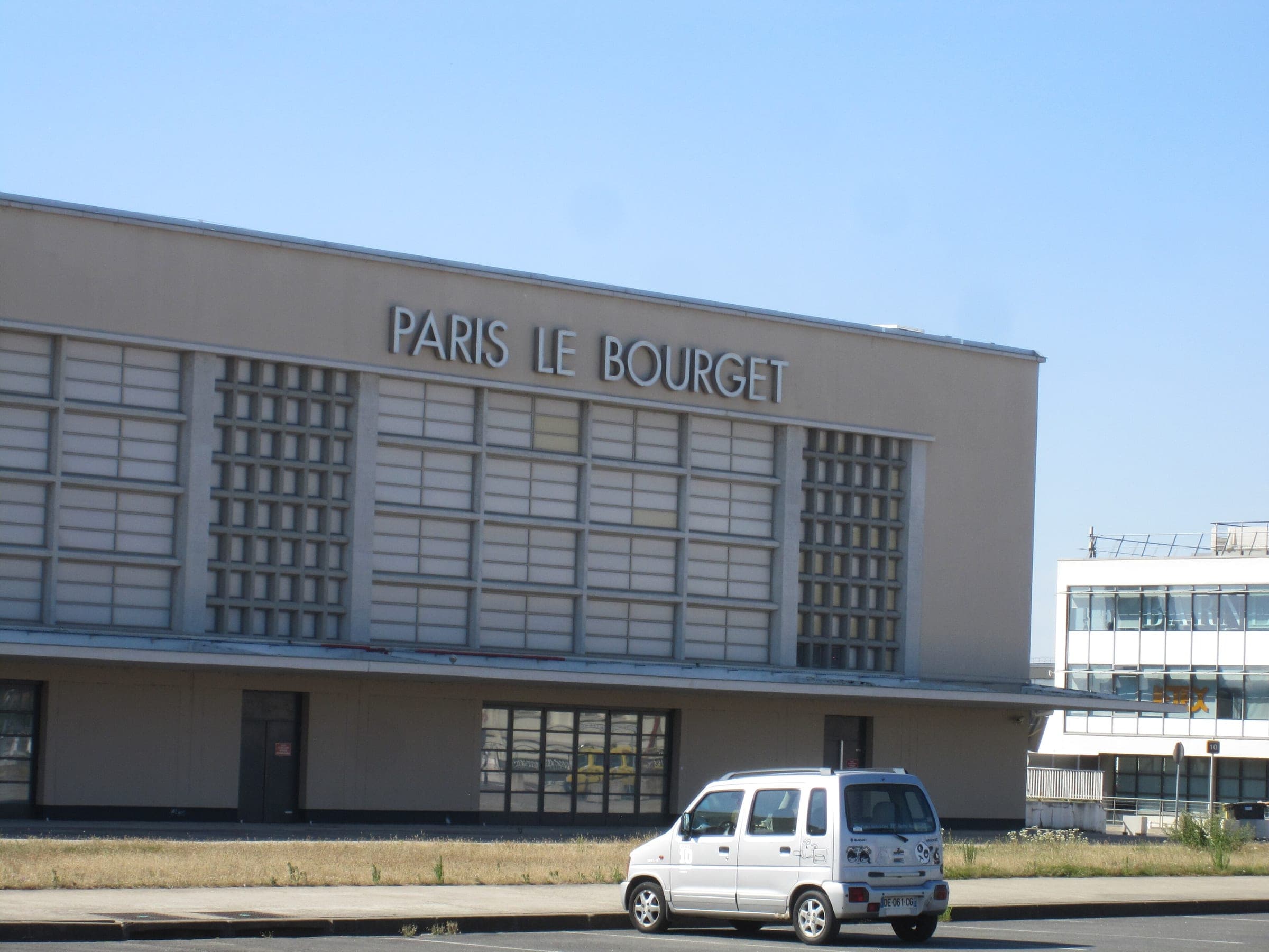 The 1937 terminal by Georges Labro: a pale stone façade with tall vertical glazing and the lettering 'Paris Le Bourget'