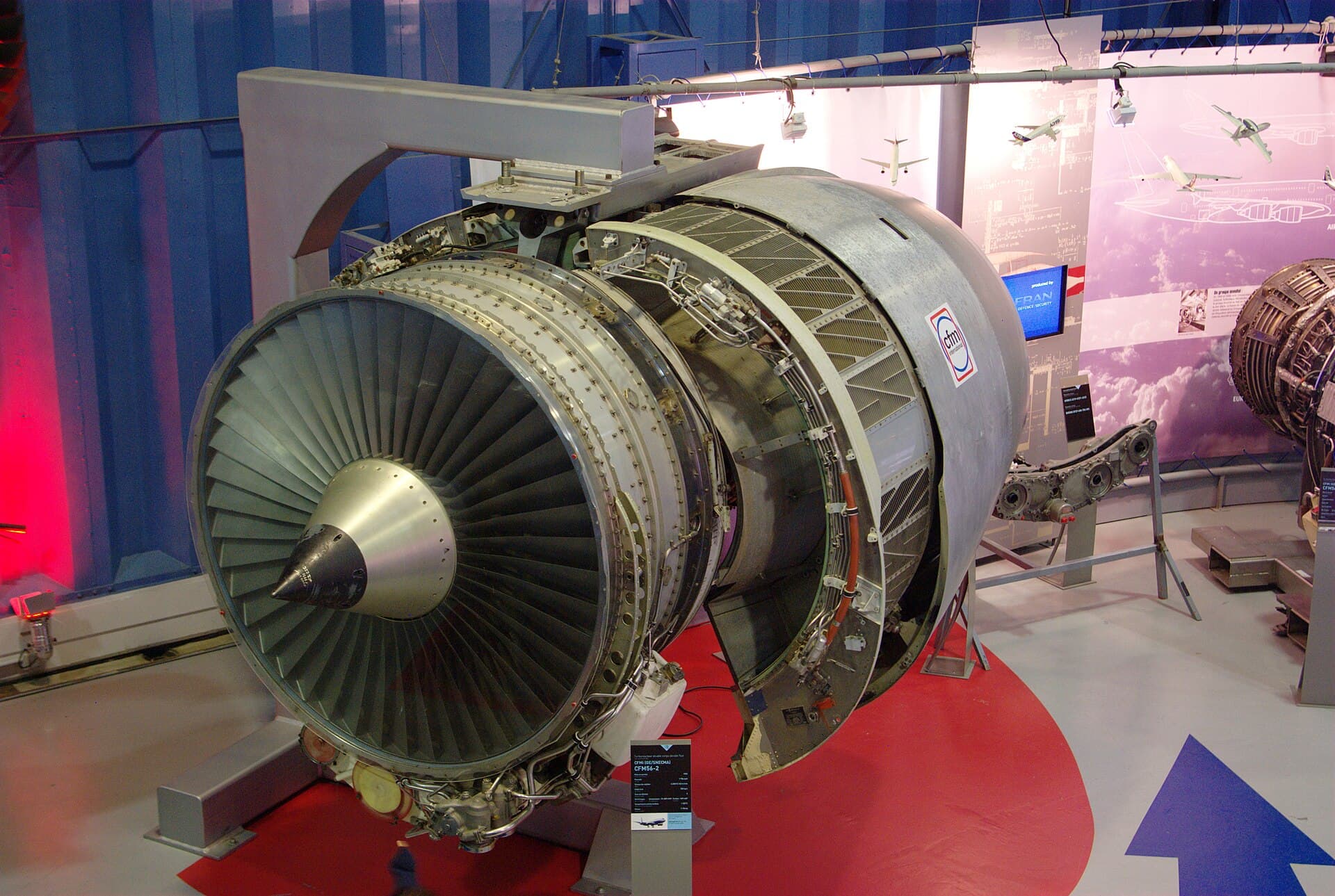 A CFM56-2 displayed at the Musée Safran with its fan cowl open, the fan, spinner and core casing clearly visible