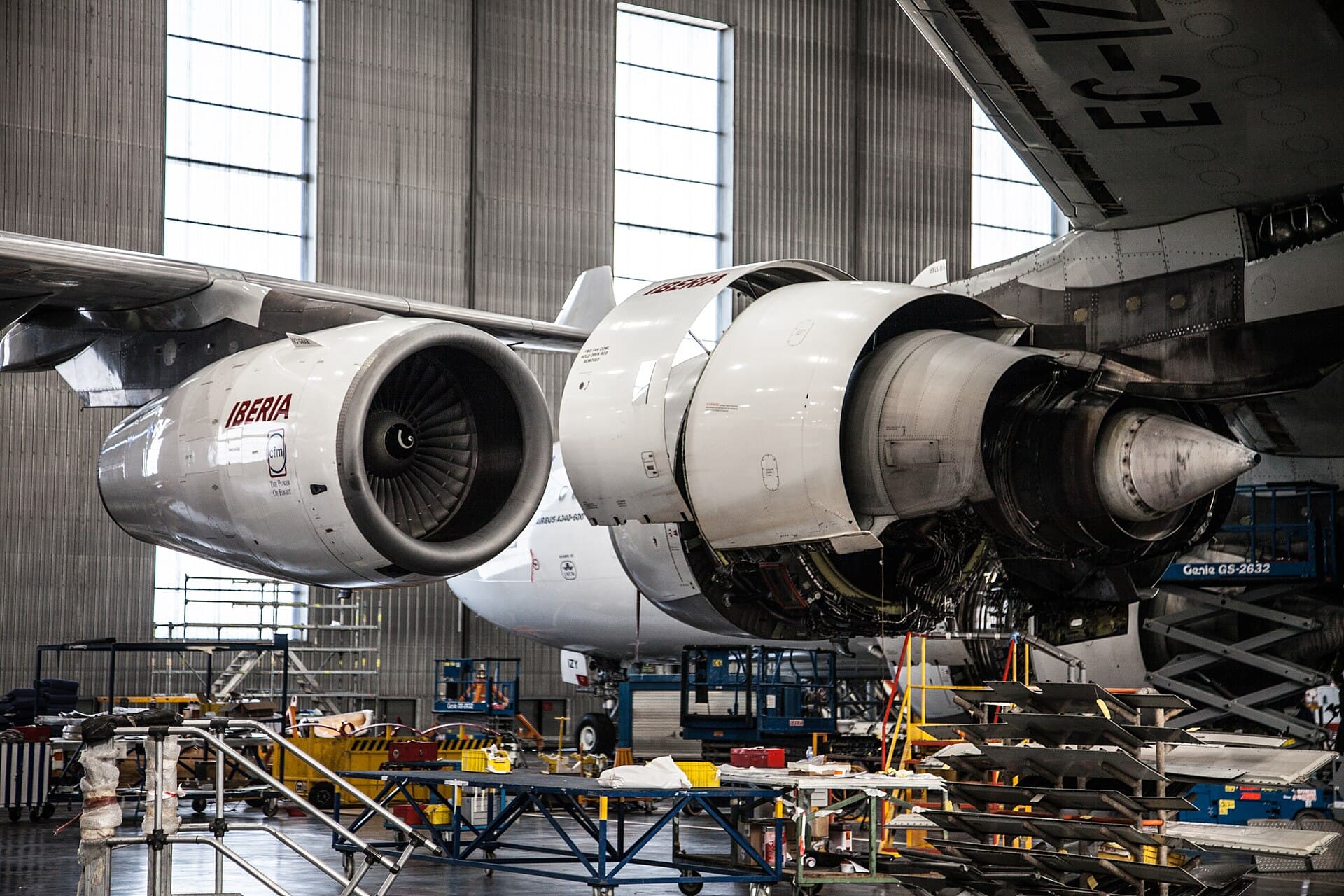An Iberia A340-300 on CFM56-5C4s beside an A340-600 on Rolls-Royce Trent 556s in the maintenance hangar at La Muñoza, Madrid