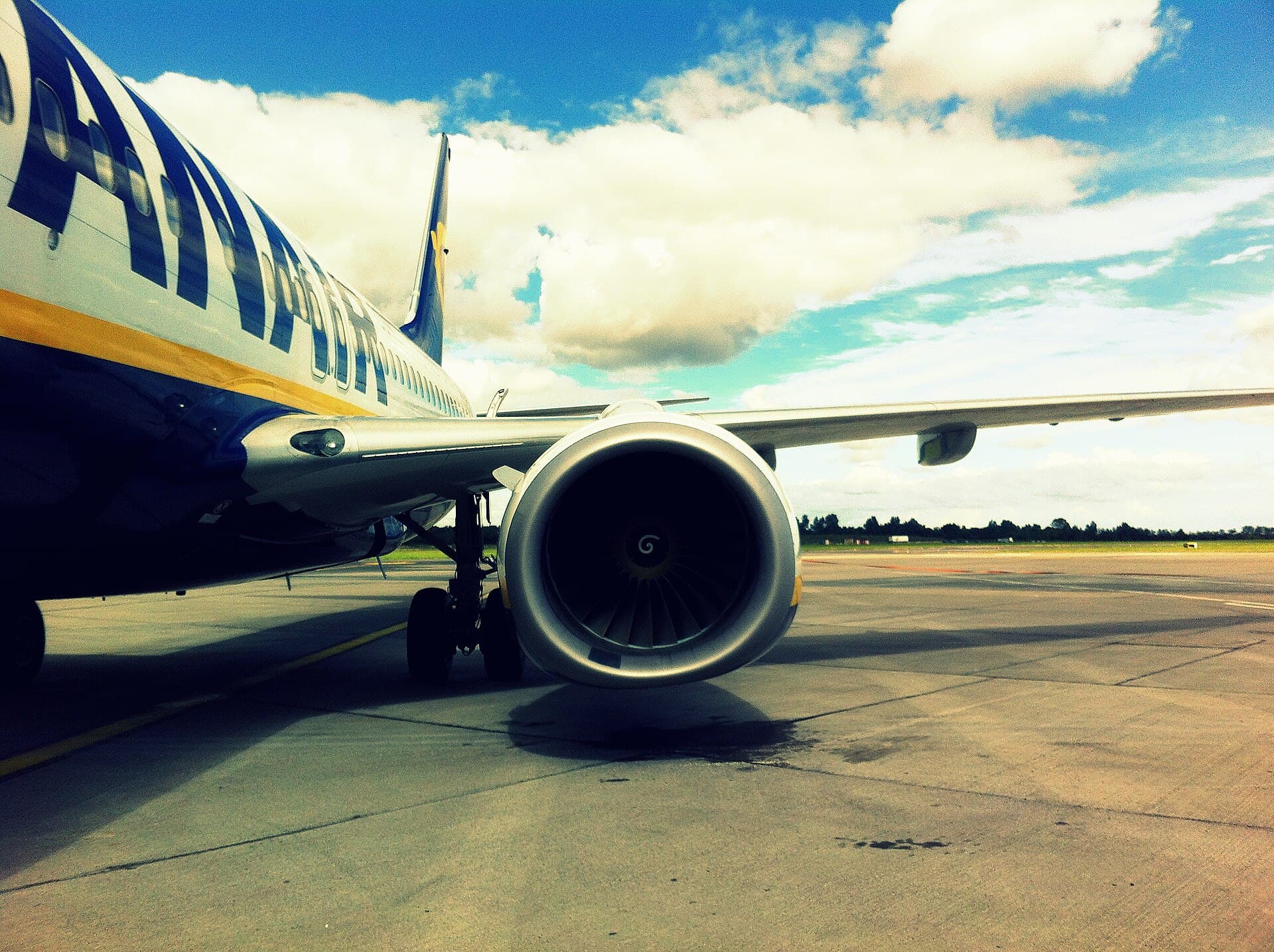 A Ryanair Boeing 737-800 on its stand at Dublin, photographed low beside the CFM56 intake