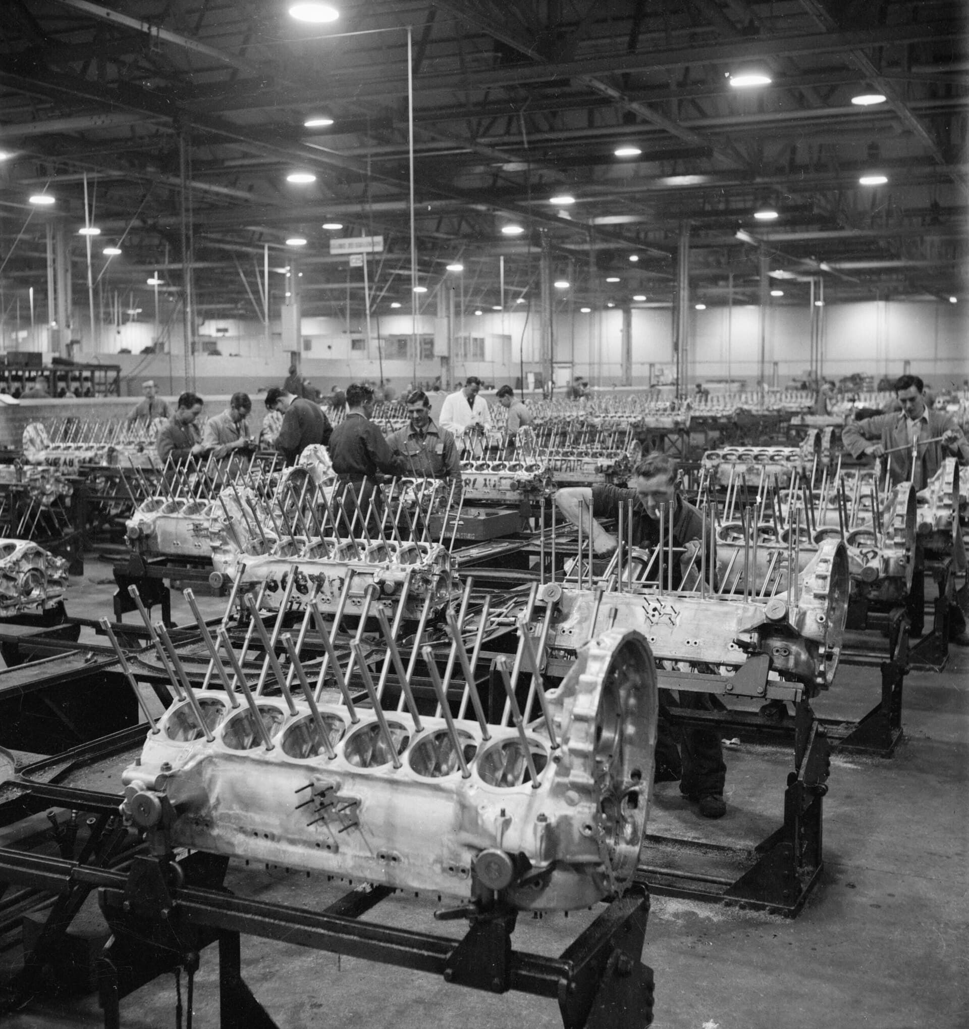 The crankcase assembly bay of a Rolls-Royce factory in 1942, rows of Merlin crankcases having their cylinder studs fitted