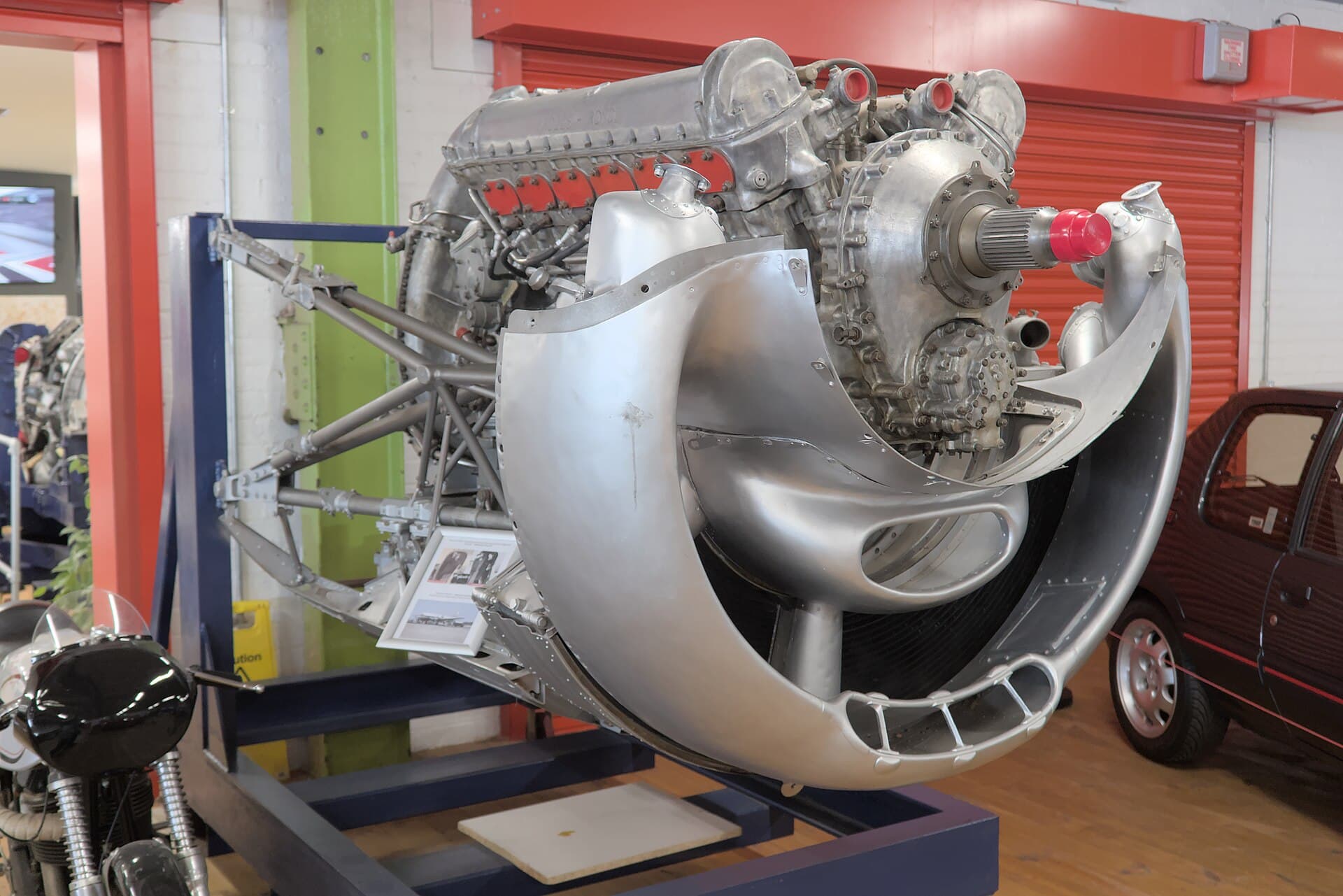 A Merlin displayed complete with its tubular bearer frame and cowling panels, showing how the engine was delivered as a single power unit