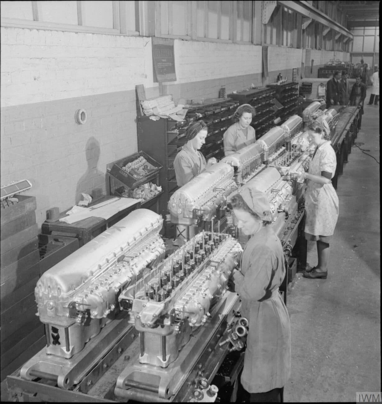Women workers attaching induction manifolds to Merlin cylinder blocks at a Rolls-Royce factory in 1942