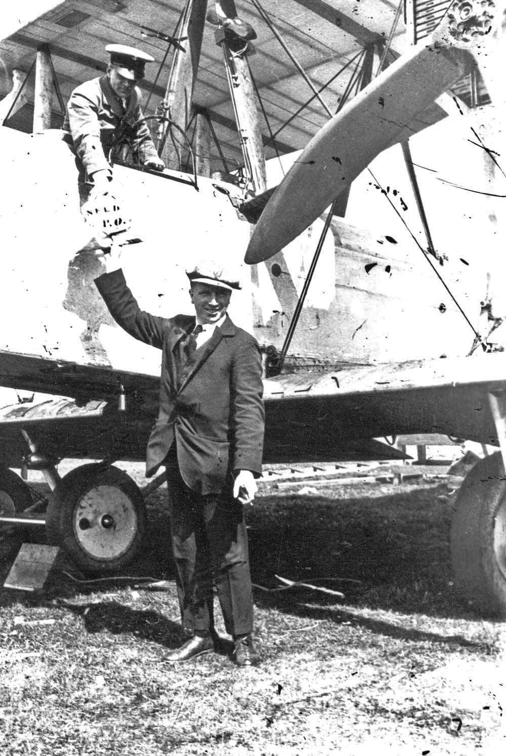 Alcock and Brown taking the bag of mail aboard the Vimy at St John's