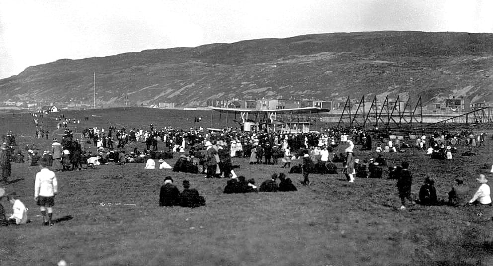 Alcock and Brown among spectators beside the Vimy in St John's