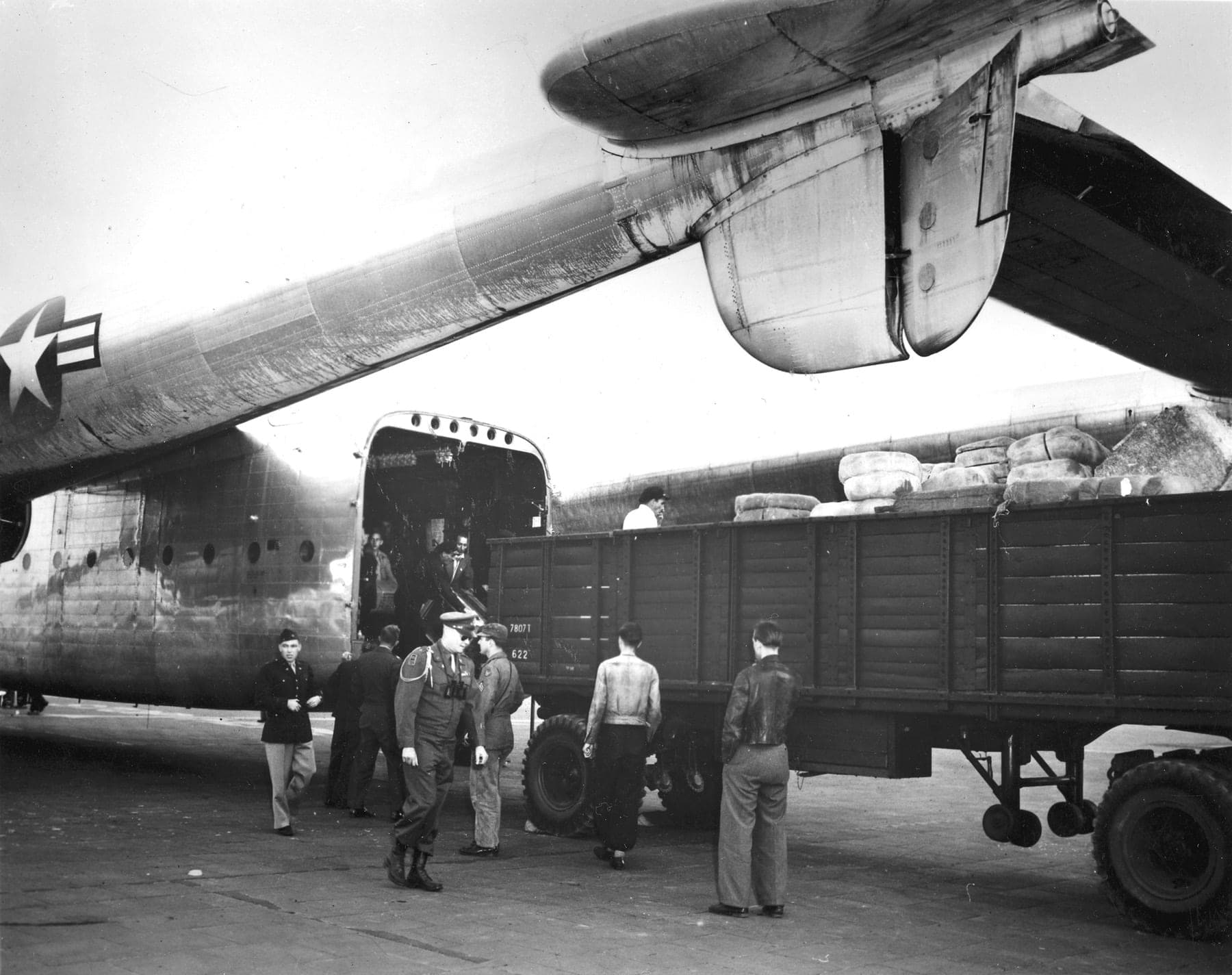 The first Fairchild C-82A Packet on the airlift being unloaded at Tempelhof