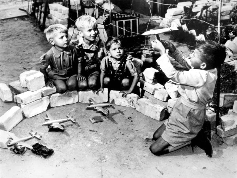 Berlin children playing at the "Luftbrücke", the air bridge