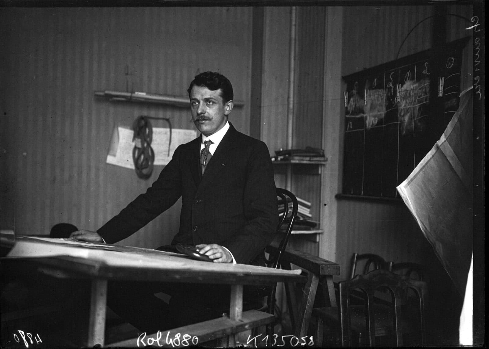 Lucien Chauvière, maker of the Intégrale propeller, seated at a drawing table in his workshop.
