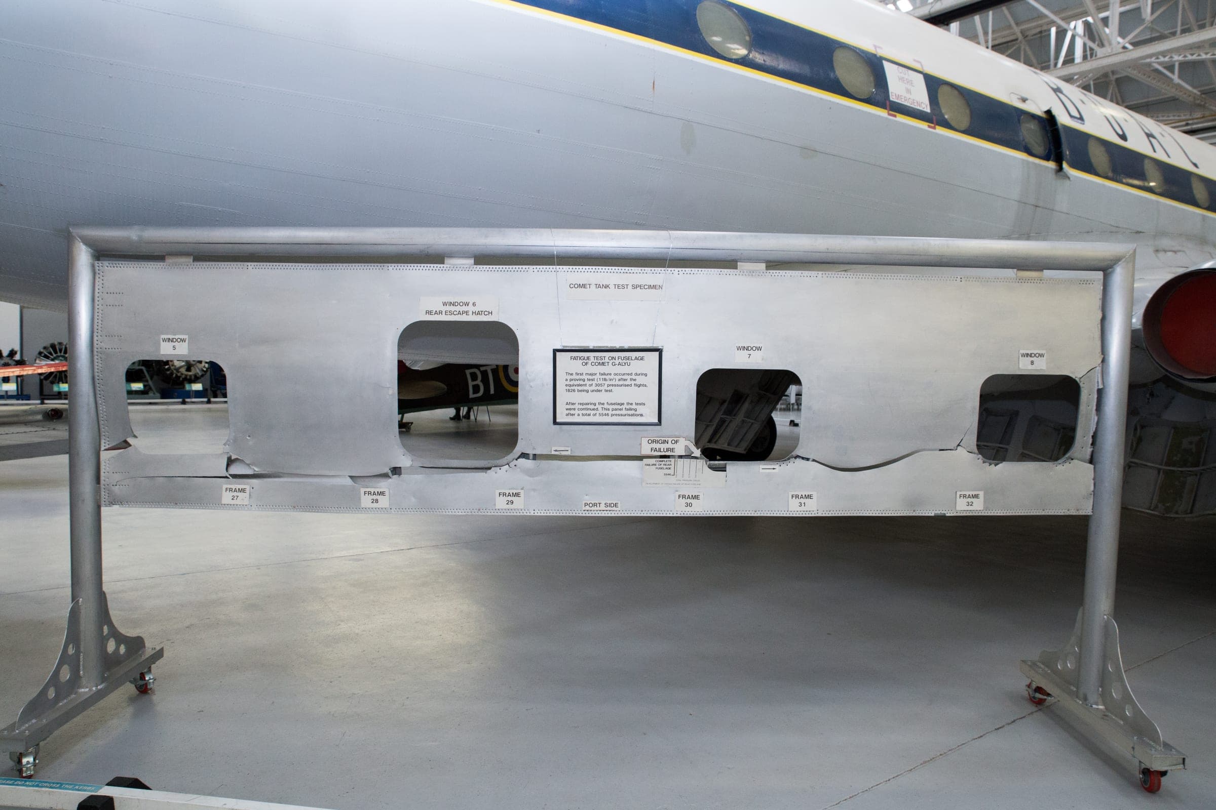 A preserved fuselage panel from Comet G-ALYU, the airframe cycled to destruction in the Farnborough water tank, with the origin of the failure marked