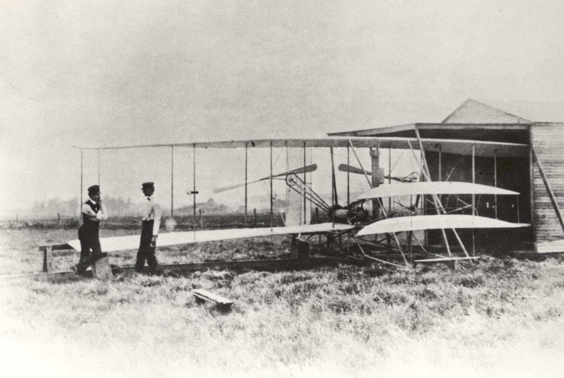 Wilbur and Orville Wright with the Flyer II at Huffman Prairie, the cow pasture outside Dayton where they learned to fly the aeroplane properly.