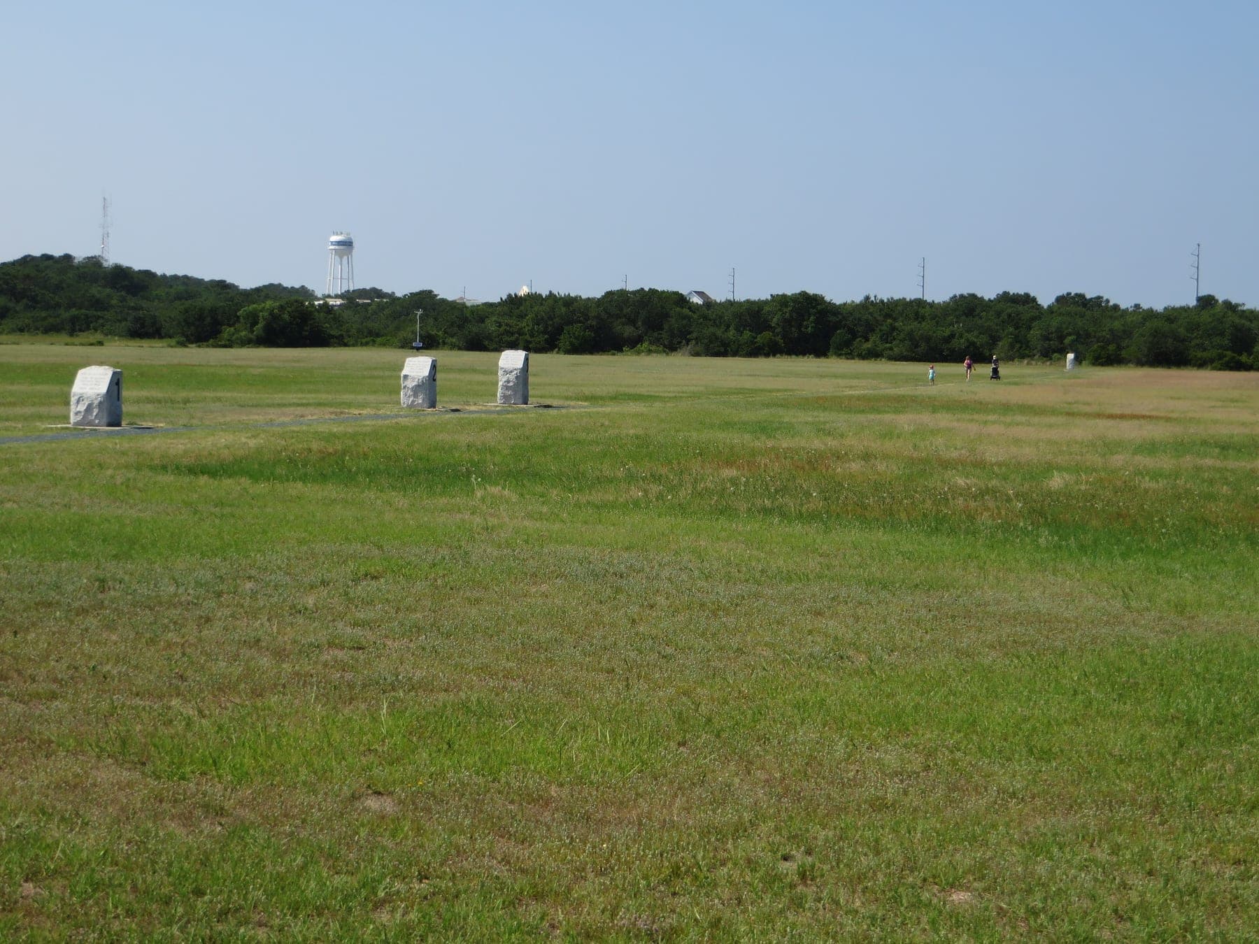 The four numbered stones on the sand at Kill Devil Hills, each marking where one of the flights of 17 December 1903 came down.