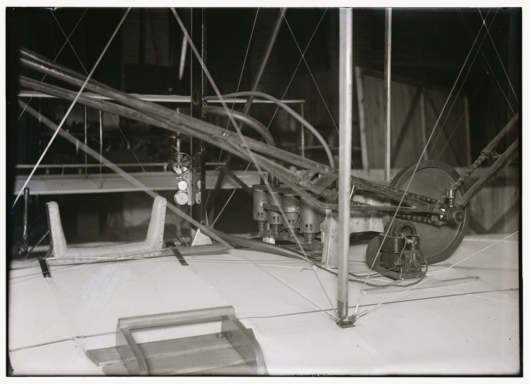The pilot's hip cradle and the engine mounted beside it on the lower wing, the pilot lay here and warped the wings by sliding his hips.