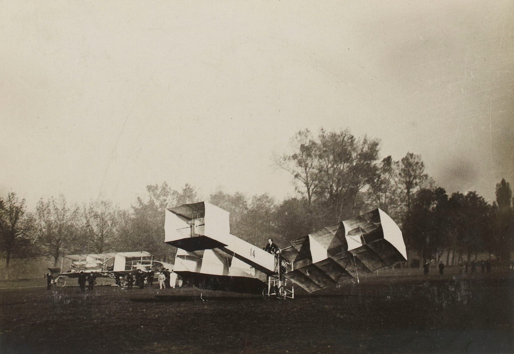 Alberto Santos-Dumont's 14-bis at Bagatelle, its box-kite cellular wings and forward control cell clearly visible.