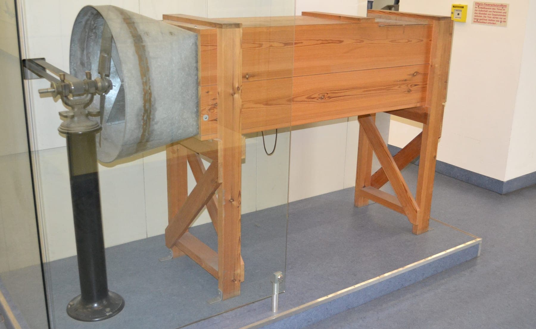 A reconstruction of the Wright brothers' wooden wind tunnel, a long open-ended box with a fan at one end.