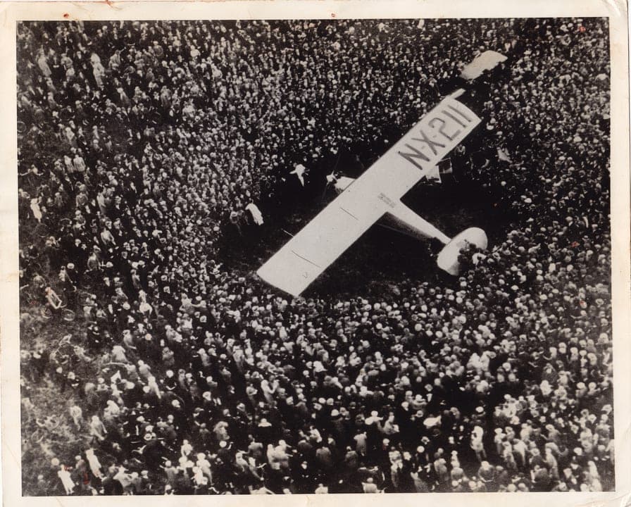 The crowd around Lindbergh on his arrival at Croydon aerodrome, south of London.