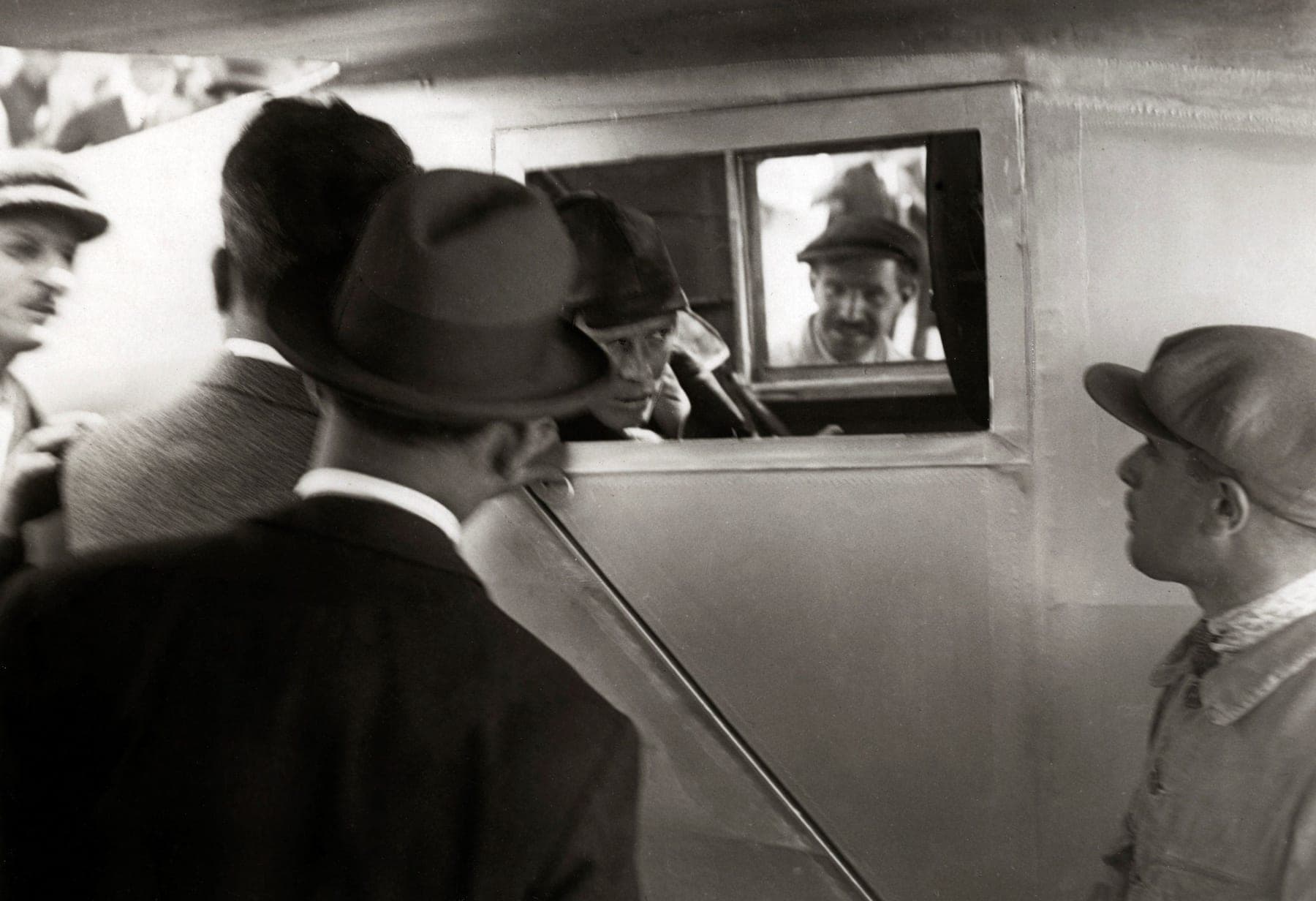 Lindbergh looking out through the side window of the enclosed cockpit: with the main fuel tank ahead of him, the side windows and a periscope were his only view.