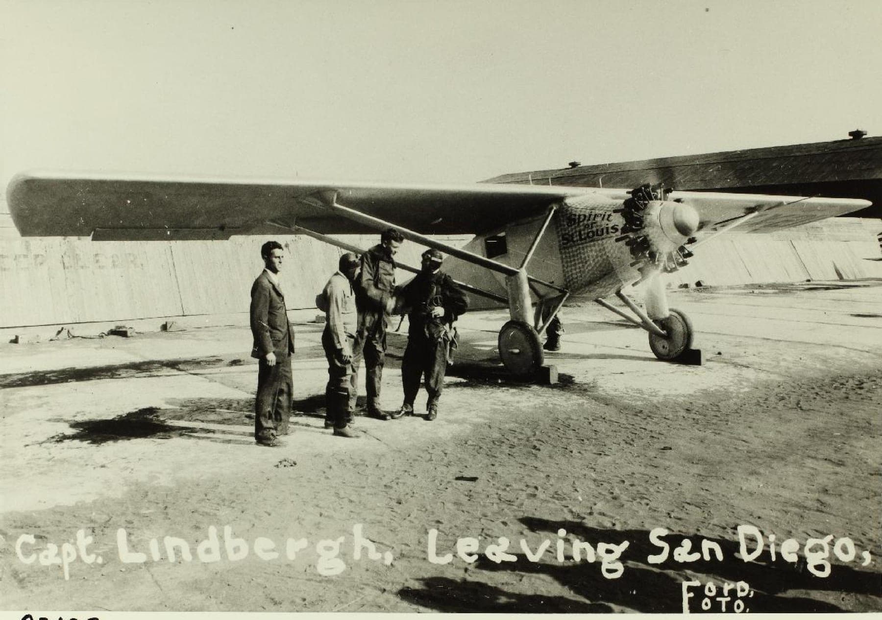 Lindbergh and the Ryan staff grouped around the Spirit at Rockwell Field, North Island, San Diego, just before the flight to St. Louis.