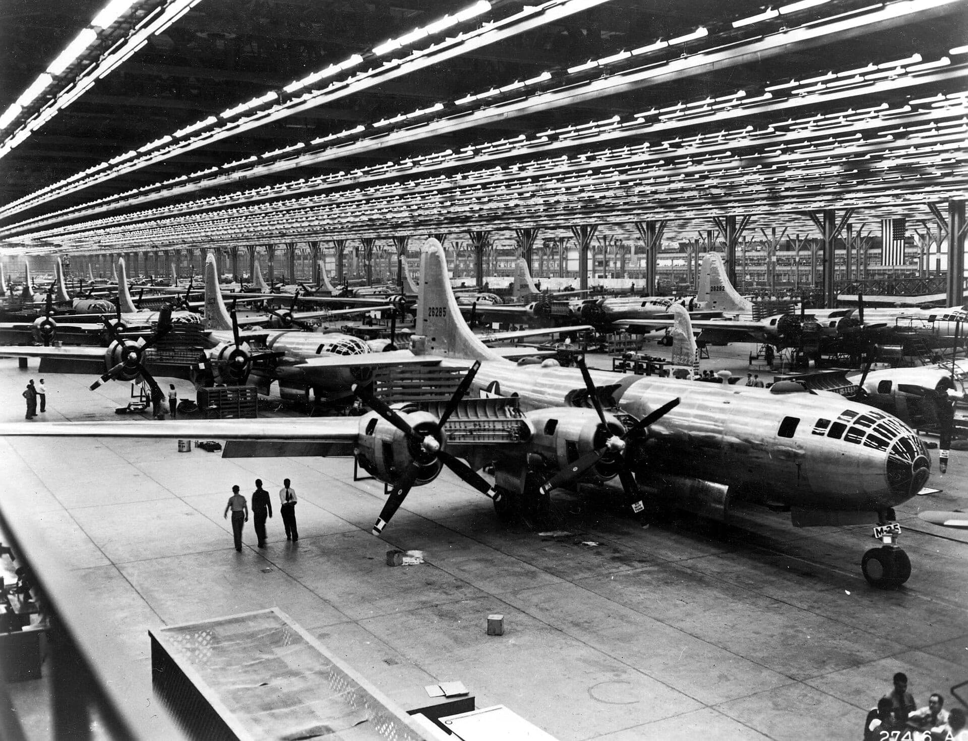 B-29 Superfortress airframes on the assembly line in 1944, wings and fuselages stretching down the hall