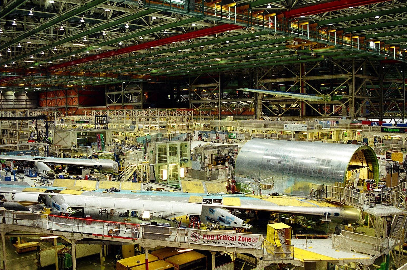 Inside the Boeing assembly hall at Everett, widebody airframes standing under the roof trusses