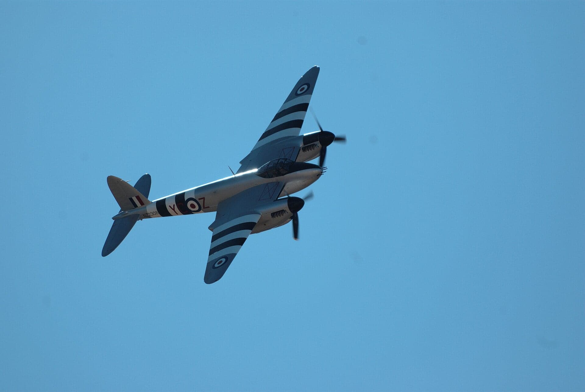 An airworthy Mosquito in wartime camouflage flying at the Warbirds Over Wanaka airshow in New Zealand