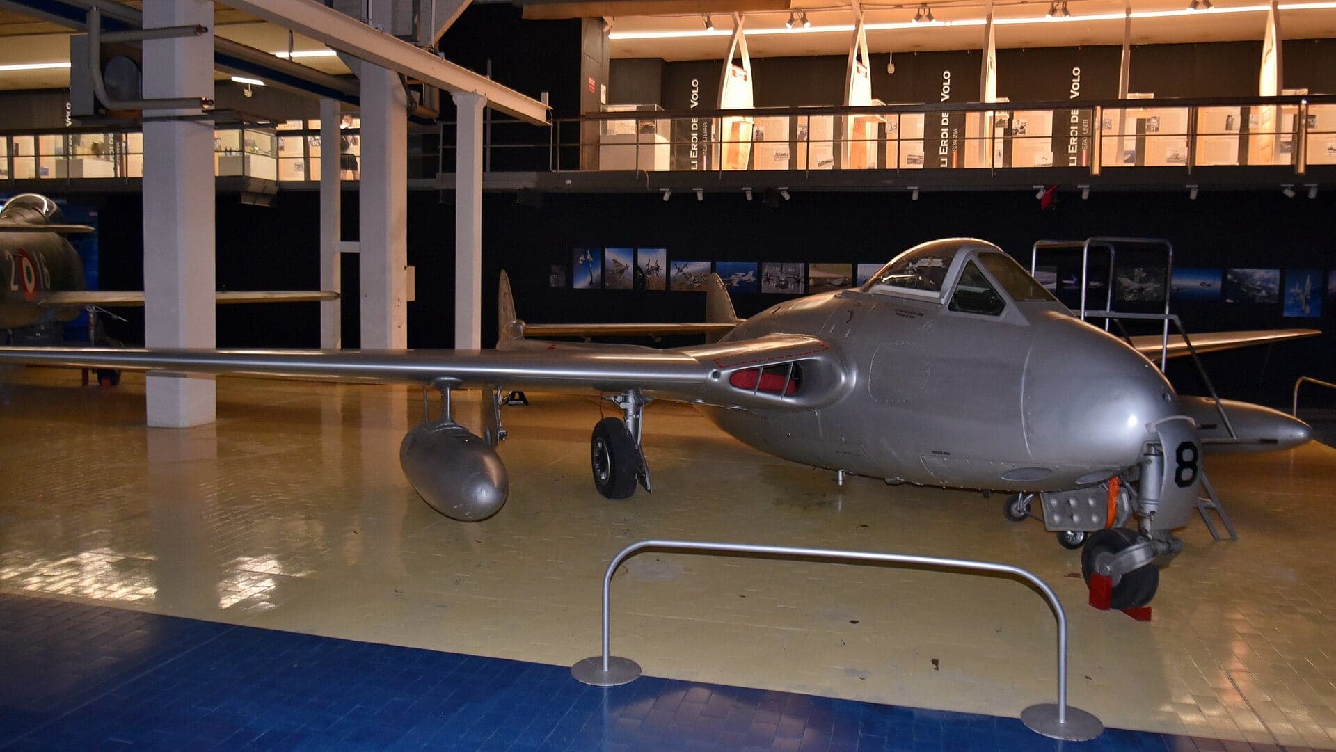 A de Havilland Vampire FB.6 twin-boom jet fighter on display at the Volandia museum in Italy